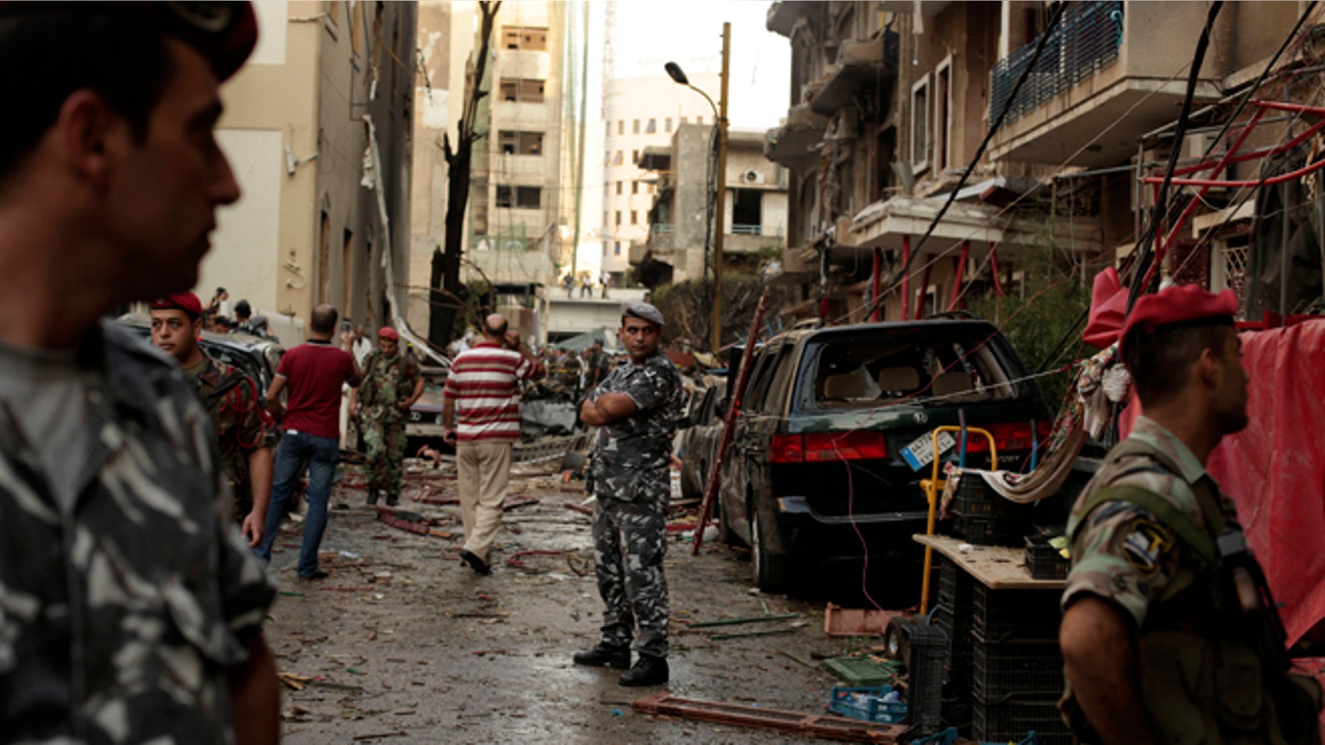 Oct. 19, 2012: Lebanese security forces gather at the site of a car bomb attack in the in the mostly Christian neighborhood of Achrafiyeh, Beirut, Lebanon.