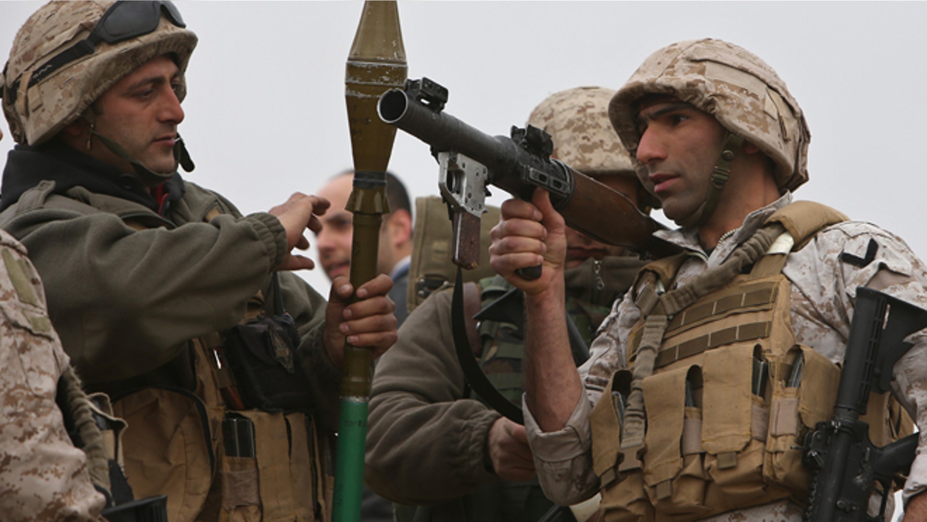 March 17, 2014: Lebanese army soldiers from a commandos unit, prepare to search an area where they blew up a bomb-packed parked car, in a field outside the village of Fakiha, near the Lebanese and Syria border, in northeast Lebanon.