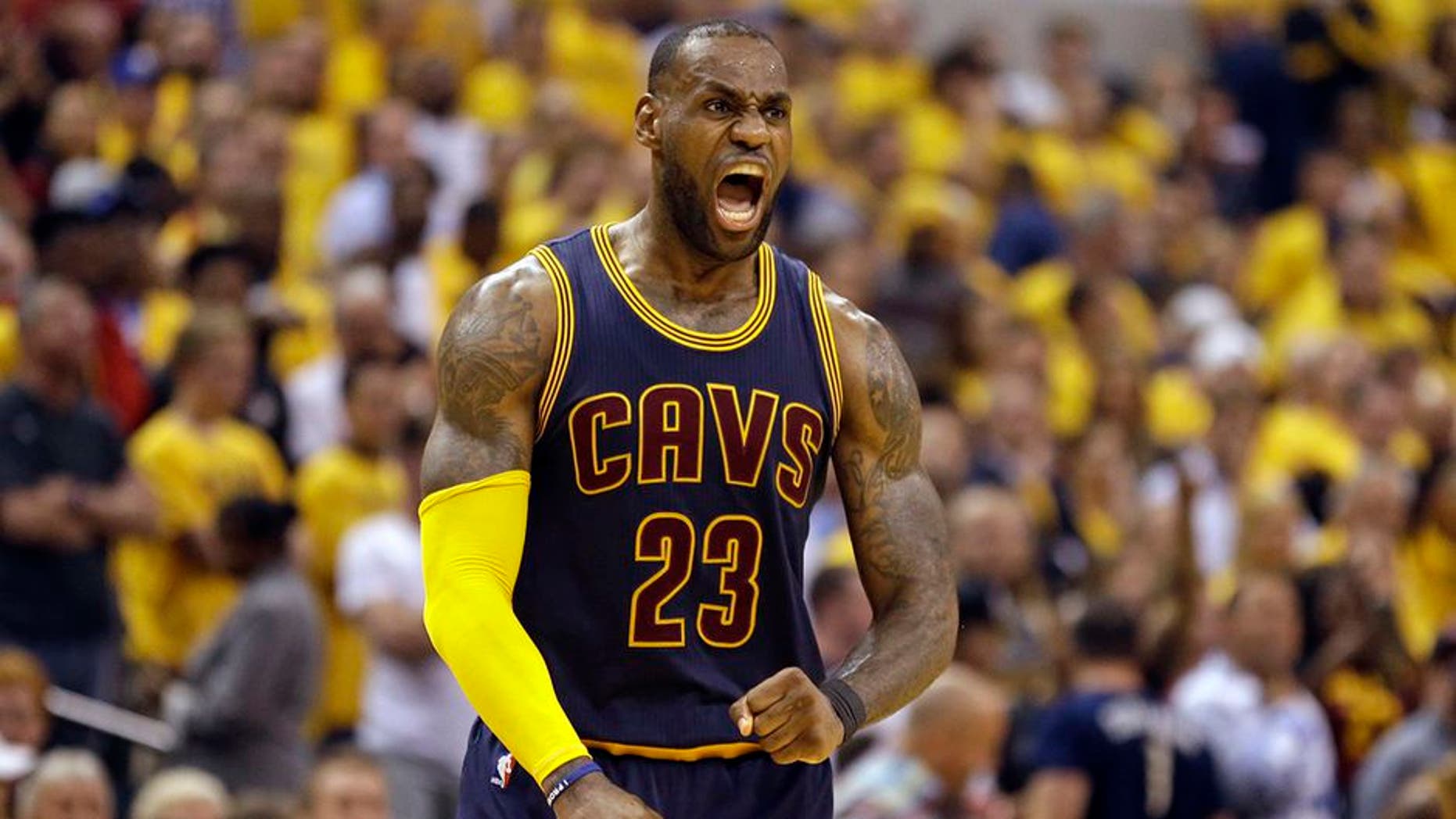 Cleveland Cavaliers forward LeBron James celebrates a basket against the Indiana Pacers during the second half of Game 3 of a first-round NBA basketball playoff series, Thursday, April 20, 2017, in Indianapolis. The Cavaliers defeated the Pacers 119-114. (AP Photo/Michael Conroy)