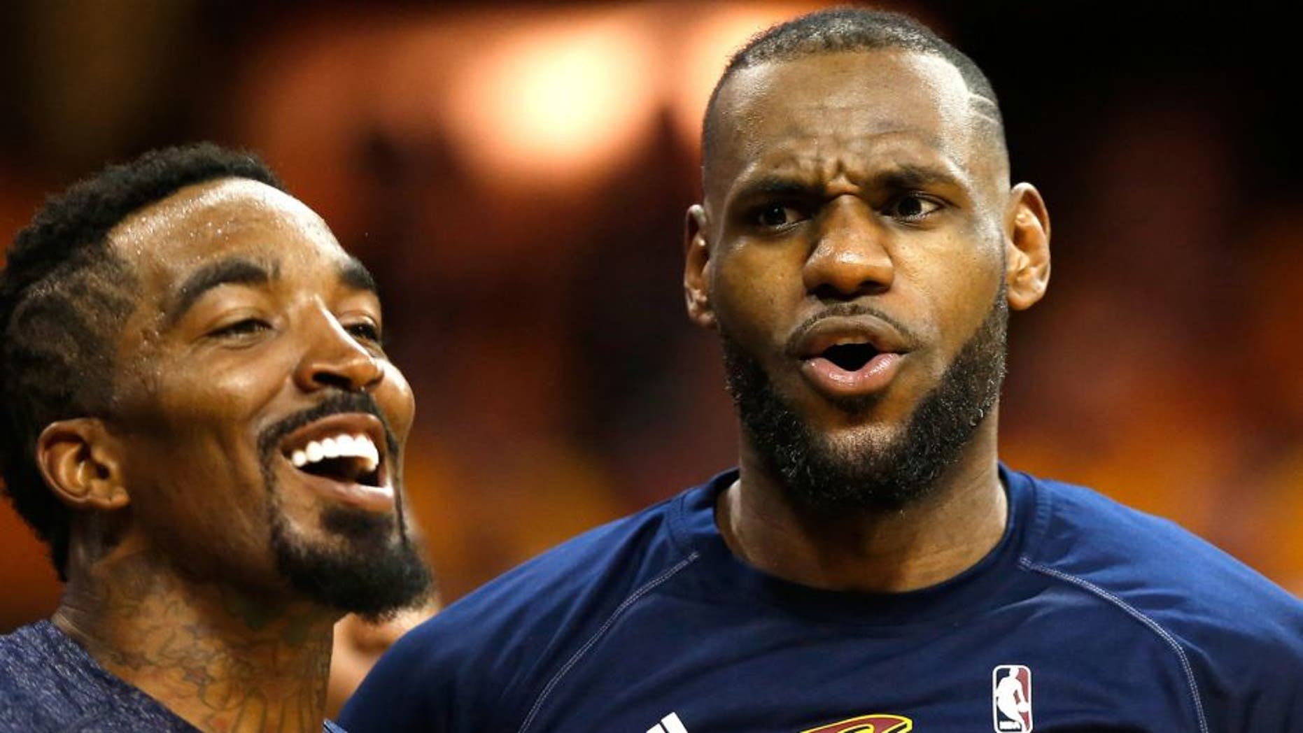 CLEVELAND, OH - MAY 26: LeBron James #23 and J.R. Smith #5 of the Cleveland Cavaliers reacts on the bench late in the fourth quarter against the Atlanta Hawks during Game Four of the Eastern Conference Finals of the 2015 NBA Playoffs at Quicken Loans Arena on May 26, 2015 in Cleveland, Ohio. NOTE TO USER: User expressly acknowledges and agrees that, by downloading and or using this Photograph, user is consenting to the terms and conditions of the Getty Images License Agreement. (Photo by Gregory Shamus/Getty Images)