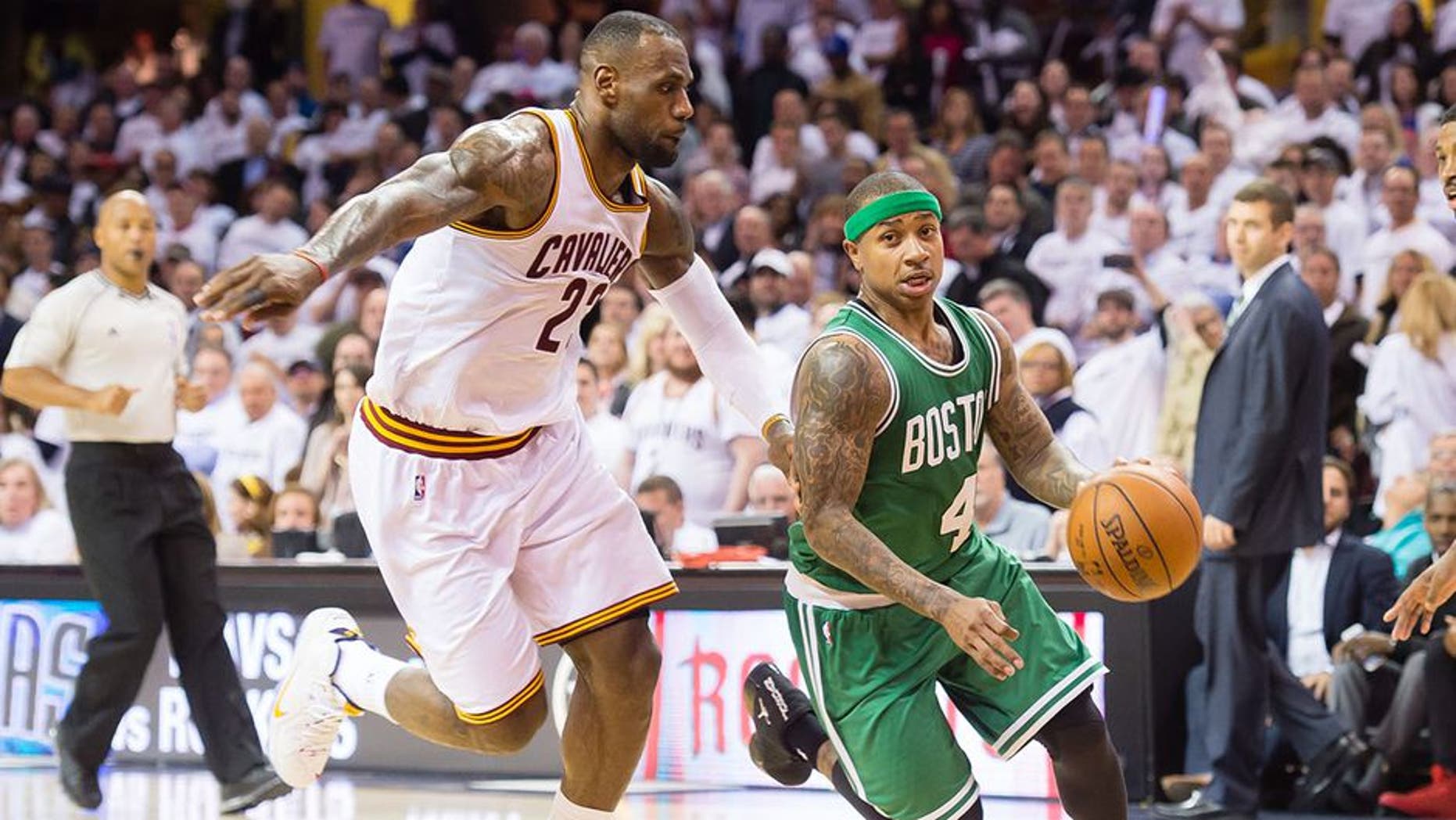 CLEVELAND, OH - APRIL 21: Isaiah Thomas #4 of the Boston Celtics drives around LeBron James #23 of the Cleveland Cavaliers in the second half in Game Two of the Eastern Conference Quarterfinals during the 2015 NBA Playoffs 2015 at Quicken Loans Arena on April 21, 2015 in Cleveland, Ohio. The Cavaliers defeated the Celtics 99-91. NOTE TO USER: User expressly acknowledges and agrees that, by downloading and or using this photograph, User is consenting to the terms and conditions of the Getty Images License Agreement. (Photo by Jason Miller/Getty Images)