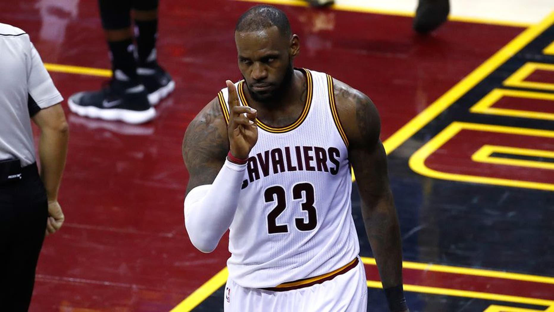 CLEVELAND, OH - JUNE 09: LeBron James #23 of the Cleveland Cavaliers reacts after a play in the second quarter against the Golden State Warriors in Game 4 of the 2017 NBA Finals at Quicken Loans Arena on June 9, 2017 in Cleveland, Ohio. NOTE TO USER: User expressly acknowledges and agrees that, by downloading and or using this photograph, User is consenting to the terms and conditions of the Getty Images License Agreement. (Photo by Gregory Shamus/Getty Images)