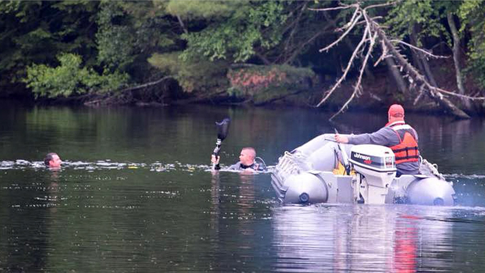 Found it! A diver brandishes a prosthetic leg after its owner lost it while jet skiing in the Hudson River