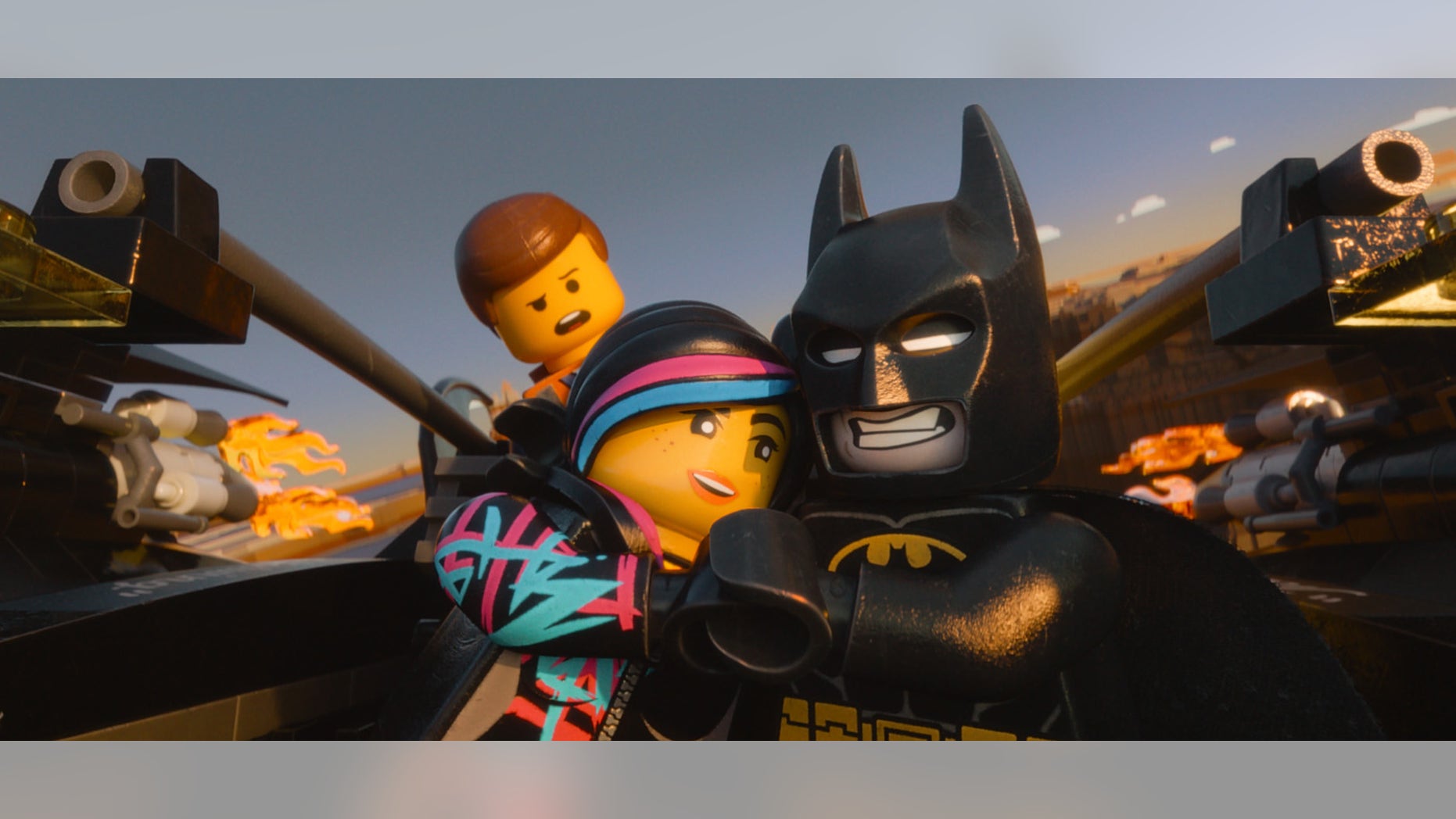 This image released by Warner Bros. Pictures shows characters, from left, Emmet, voiced by Chris Pratt, Wyldstyle, voiced by Elizabeth Banks and Batman, voiced by Will Arnett, in a scene from "The Lego Movie."