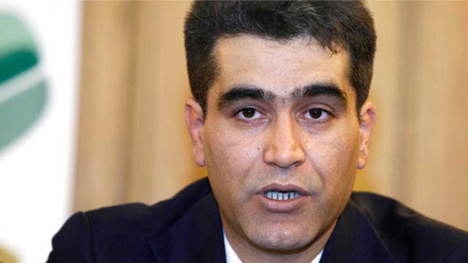 Nov. 17: Former Iranian Air Force officer Behzad Masoumi Legwan reacts during a press conference in Paris. Legwan says he intends to serve as a bridge between military officers and resistance forces.