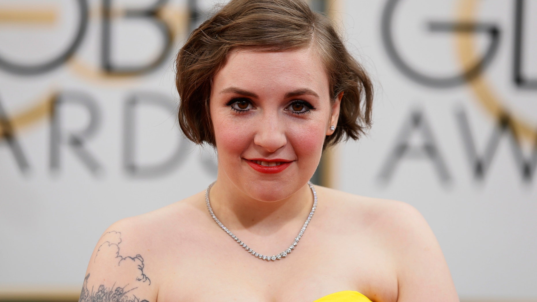 January 12, 2104. Lena Dunham arrives at the 71st annual Golden Globe Awards in Beverly Hills, California.
