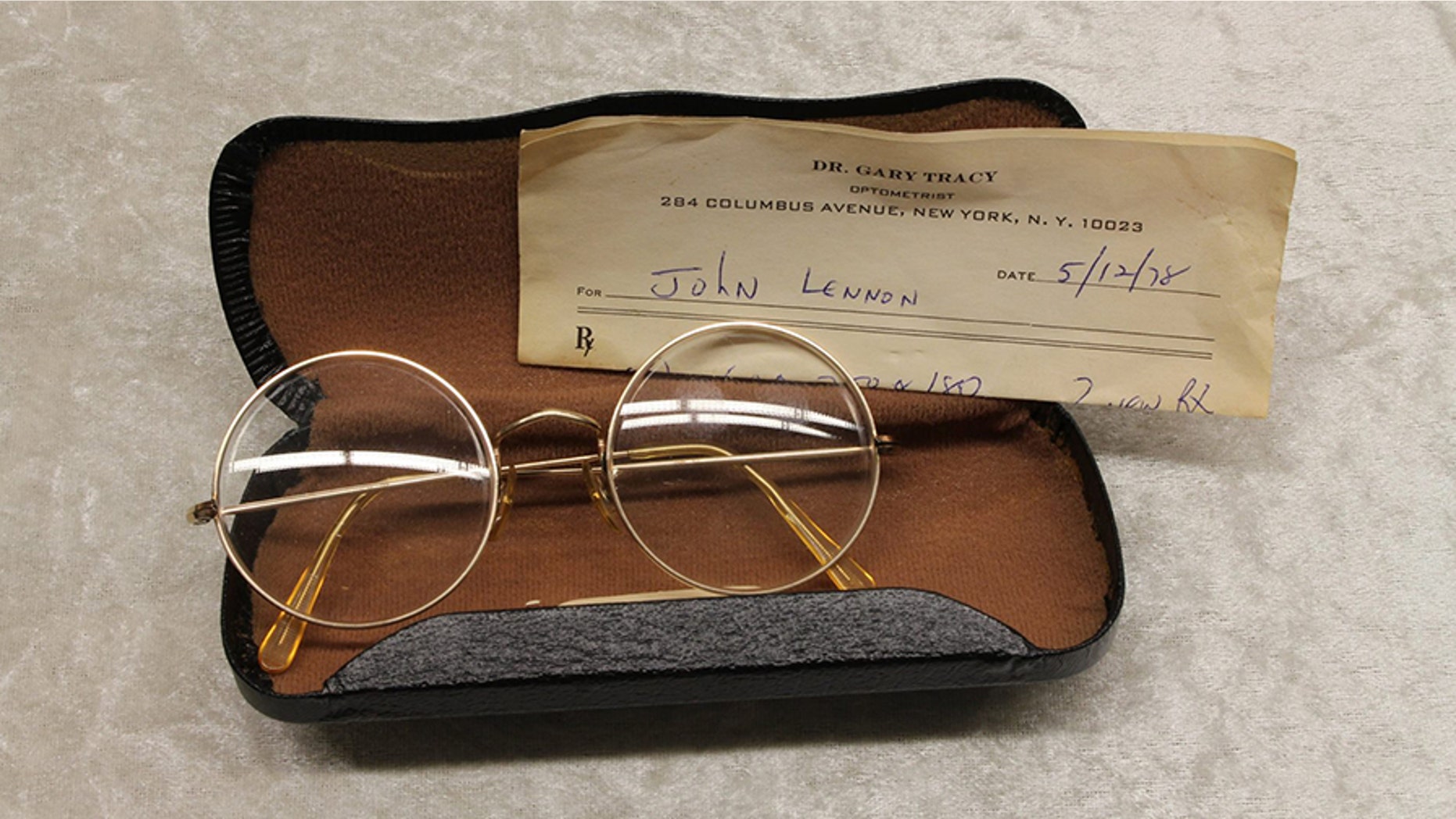 John Lennon's glasses with a prescription from optometrist Gary Tracy were displayed at the police headquarters in Berlin Tuesday.