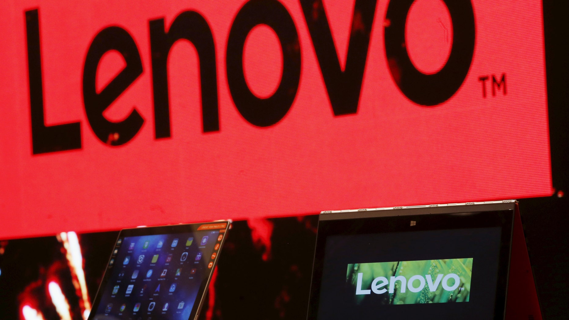 File photo - A Lenovo ultrabook and a tablet are displayed during a news conference in Hong Kong, China May 21, 2015. (REUTERS/Bobby Yip)