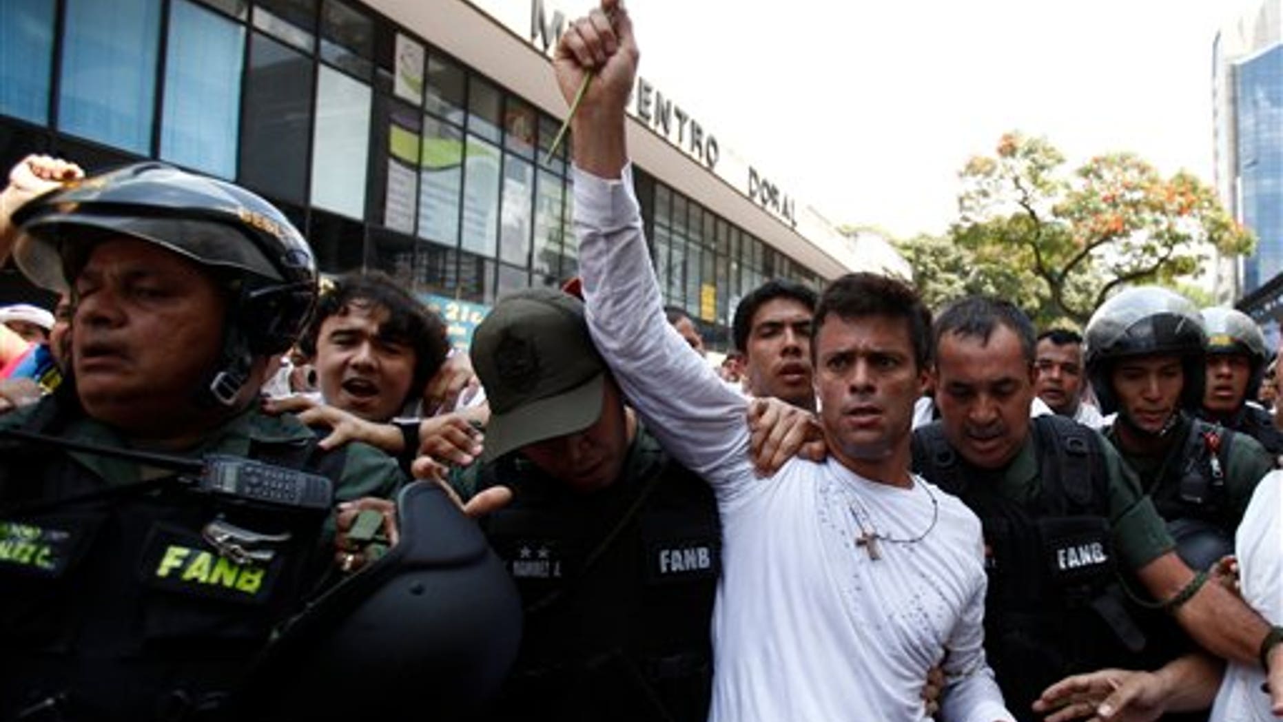 Leopoldo Lopez is taken into custody by Bolivarian National Guards in Caracas, Venezuela, on Feb. 18, 2014.