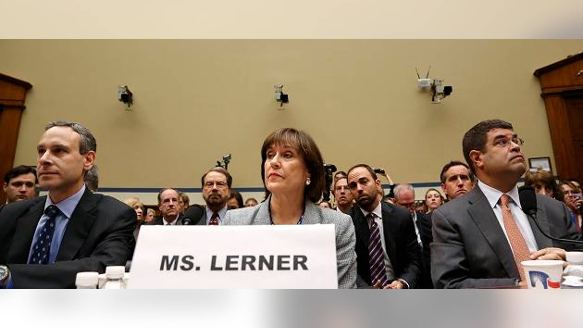 Former U.S. Internal Revenue Service Commissioner Douglas Shulman (L-R), IRS Director of Exempt Organizations Lois Lerner and U.S. Deputy Treasury Secretary Neal Wolin take their seats to testify before a House Oversight and Government Reform Committee hearing on targeting of political groups seeking tax-exempt status from by the IRS, on Capitol Hill in Washington, May 22, 2013. REUTERS/Jonathan Ernst (UNITED STATES - Tags: POLITICS BUSINESS) - RTXZWRA