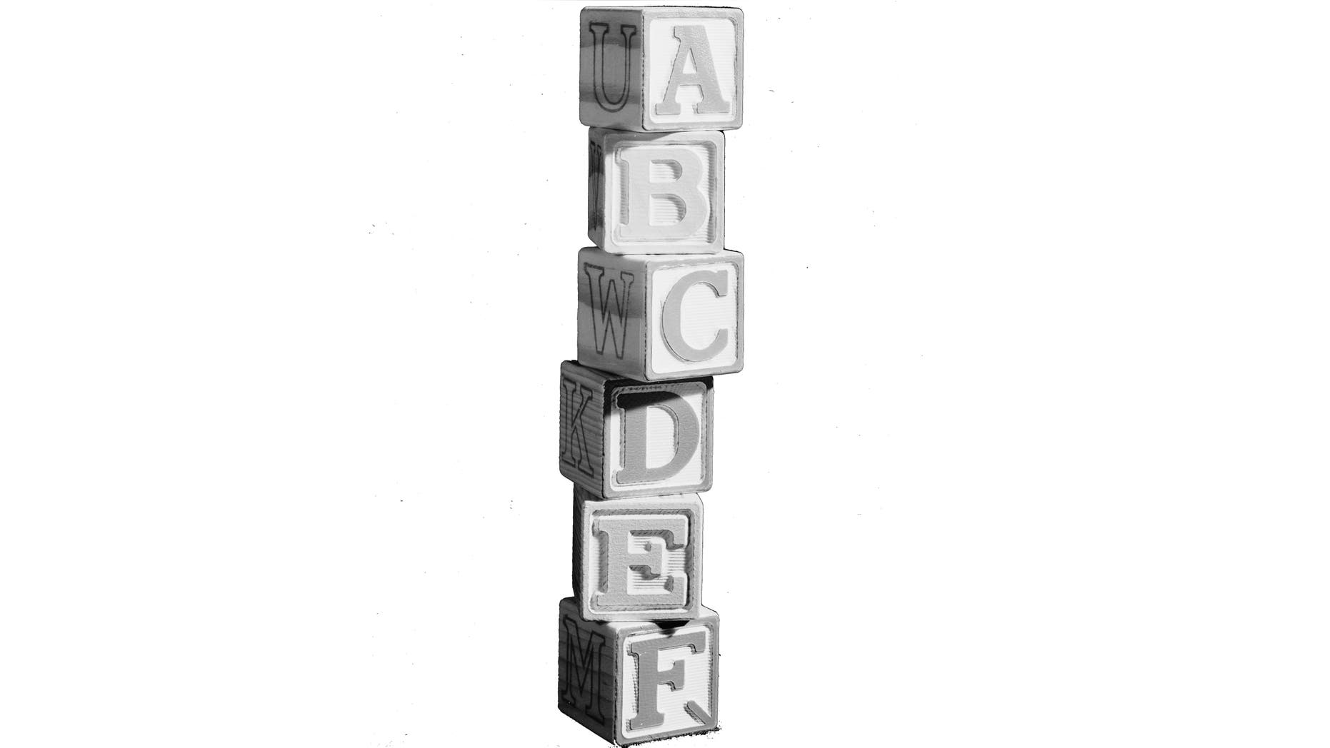 17th July 1962: A wobbly tower of building blocks with the letters of the alphabet on them. Marlon House. (Photo by Chaloner Woods/Getty Images)