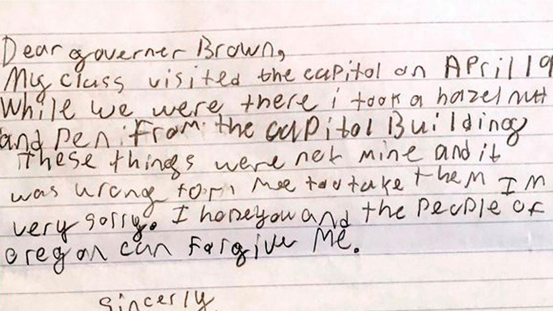 This photo provided by the Office of Oregon Gov. Kate Brown shows a portion of an apology letter from a fourth-grader to Gov. Brown, explaining that his class had toured the Capitol on a field trip in April 2017 and how he took a hazelnut and a pen from the Capitol Building.