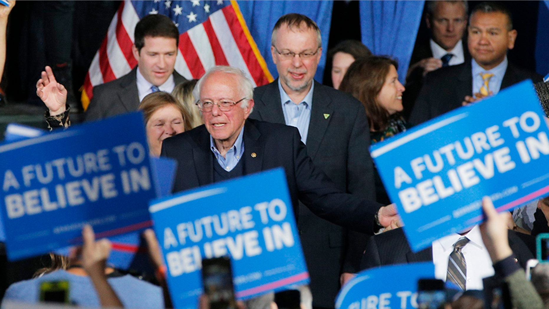 Levi Sanders stands behind his father Sen. Bernie Sanders, I-Vt., in 2016 during his Democratic primary presidential run.