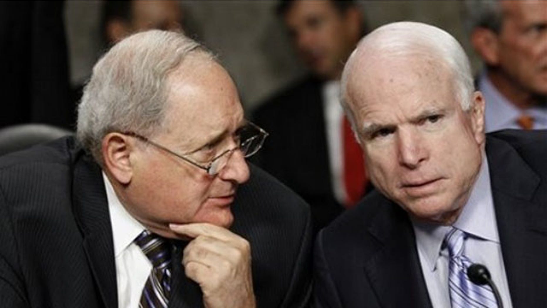 Senate Armed Services Committee Chairman Sen. Carl Levin, left, talks with the committee's ranking Republican Sen. John McCain on Capitol Hill Aug. 3. (AP Photo)