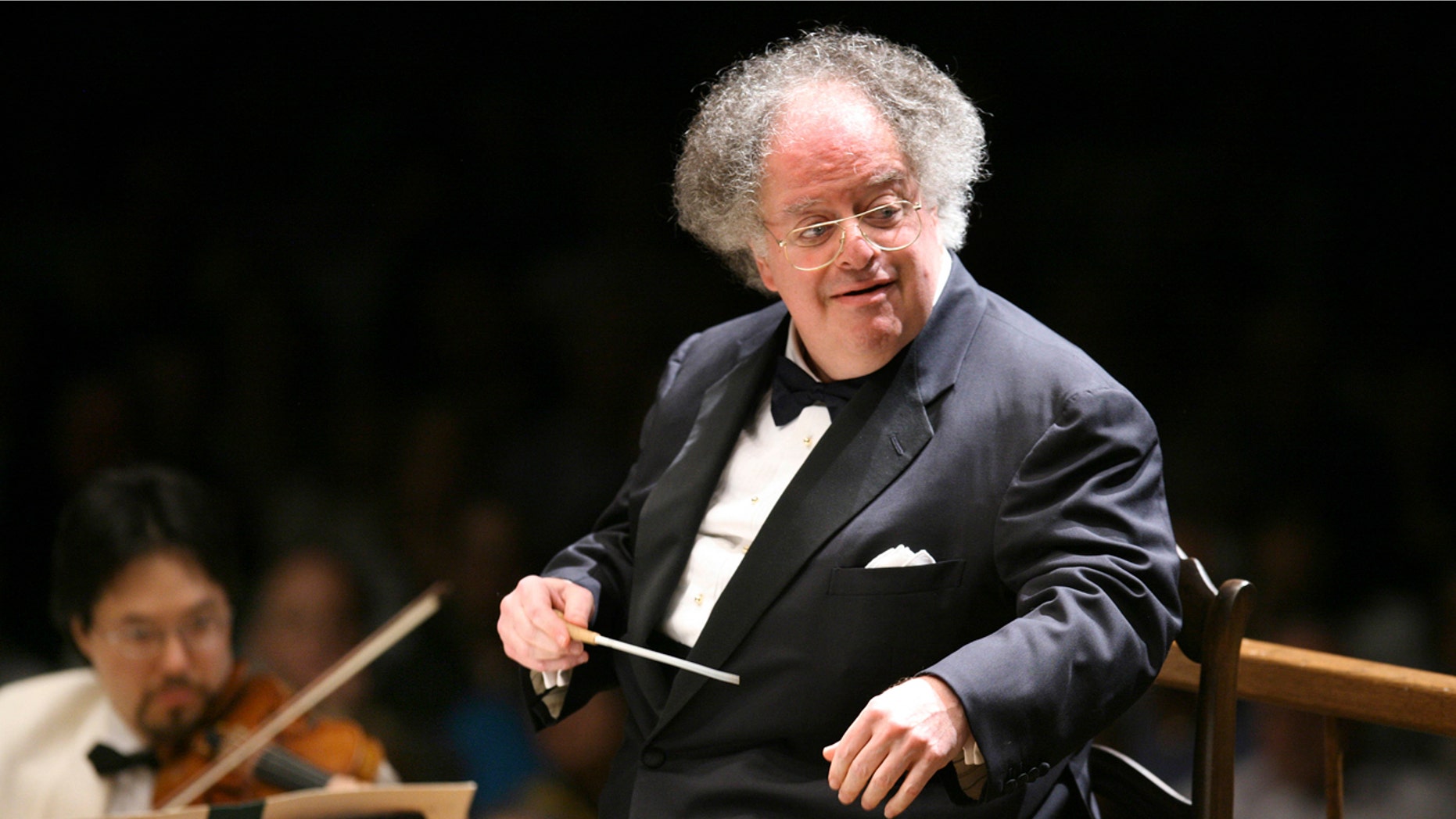 In this July 7, 2006 file photo, Boston Symphony Orchestra music director James Levine conducts the symphony on its opening night performance at Tanglewood in Lenox., Mass.