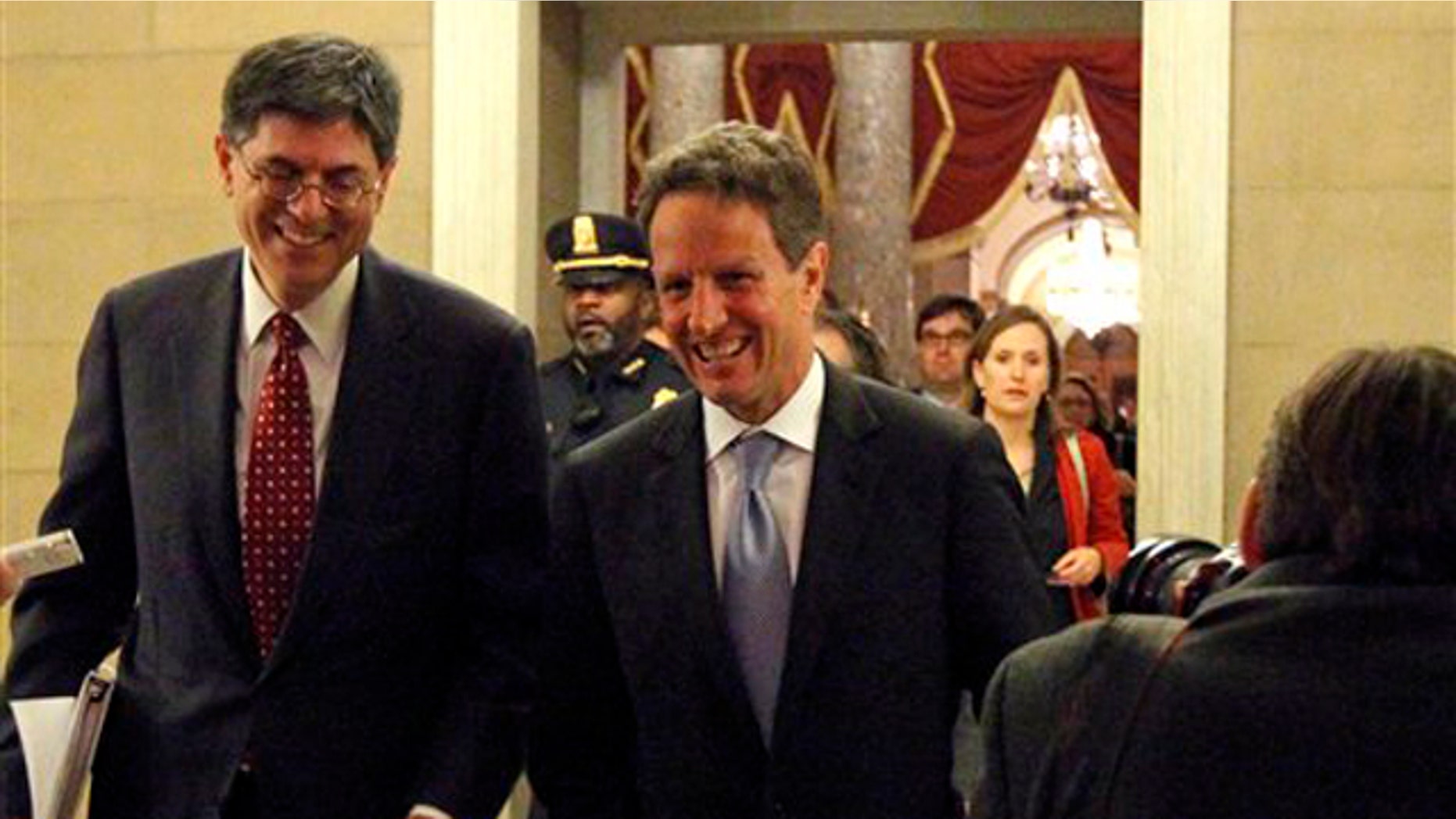 Treasury Secretary Timothy Geithner, center, with White House budget director Jacob Lew, arrive at the speaker's office for a meeting about tax cuts on Capitol Hill Dec. 1. (AP Photo)