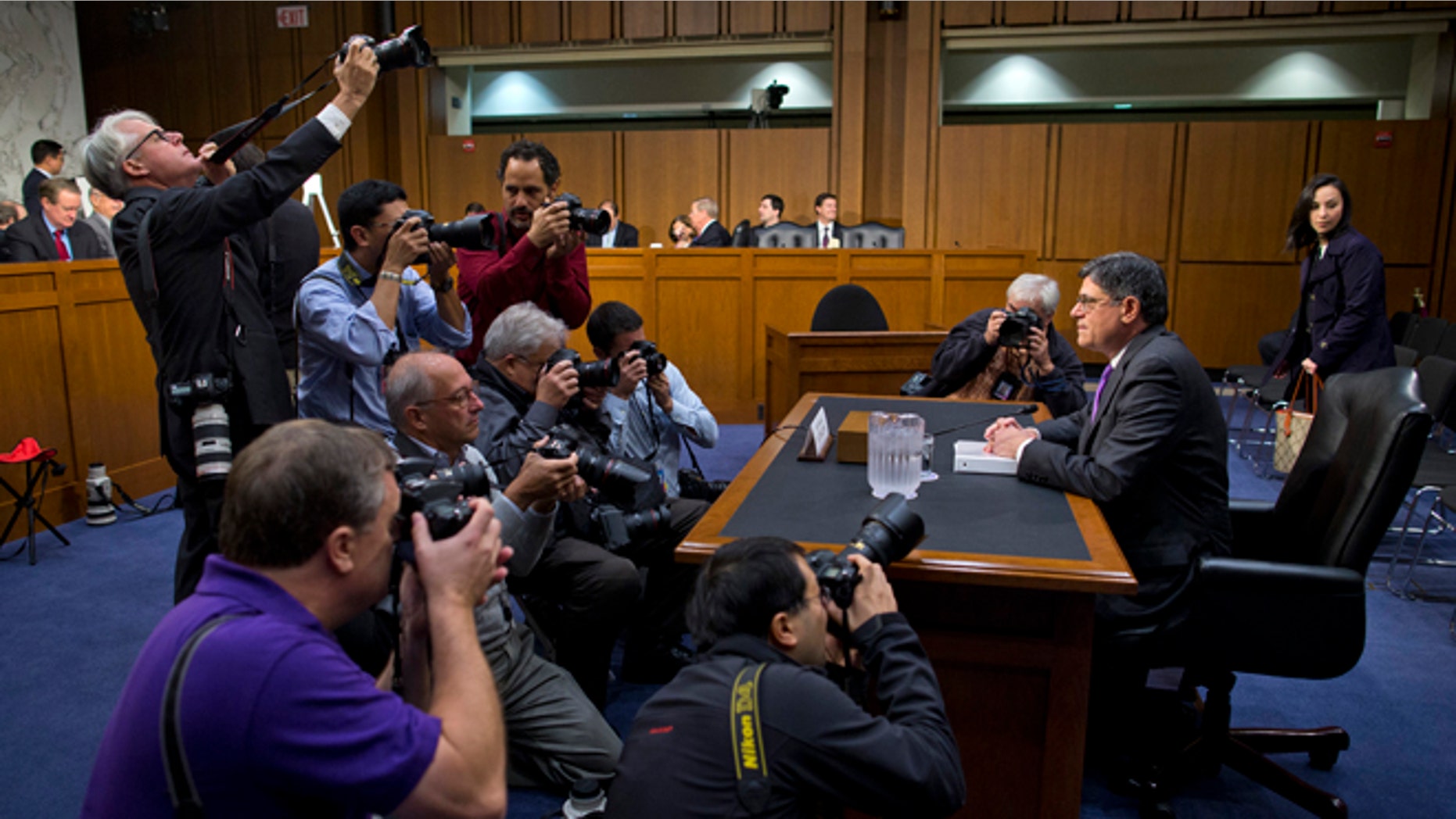 Oct. 10, 2013: Treasury Secretary Jacob Lew is surrounded by photographers prior to testifying on Capitol Hill in Washington.