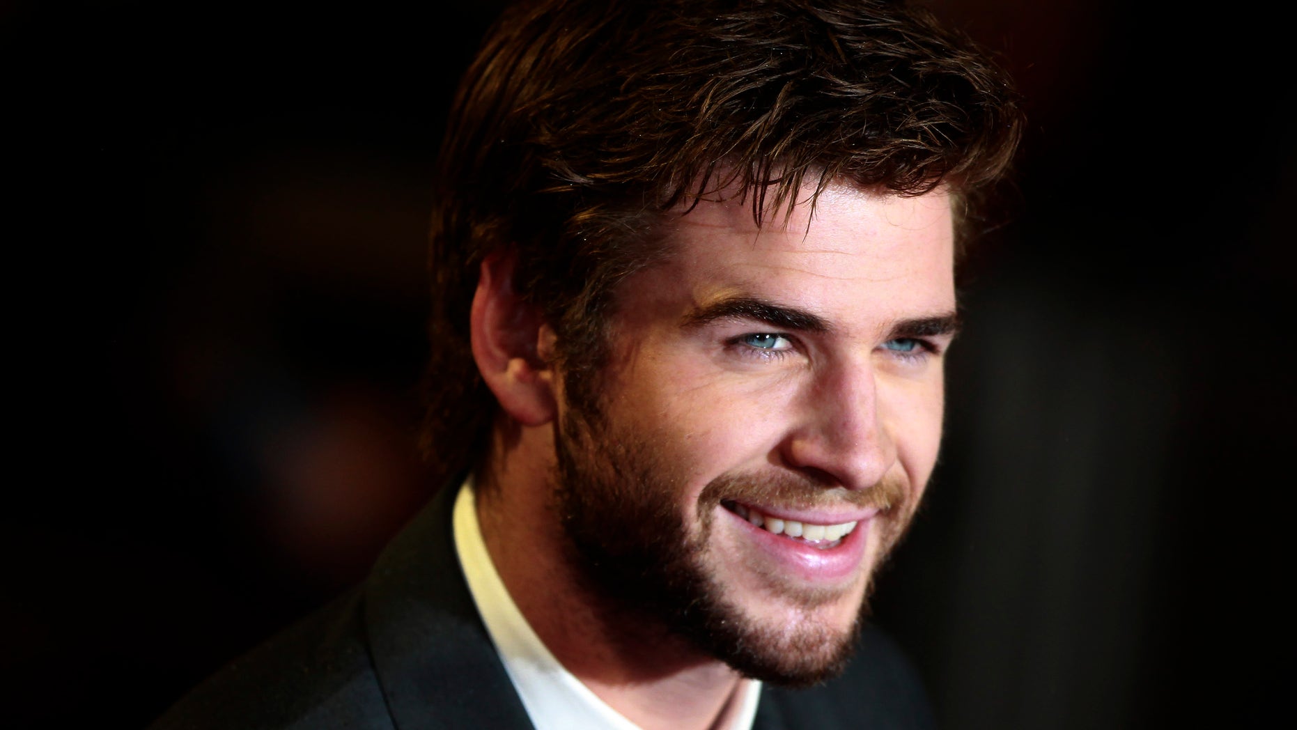 Actor Liam Hemsworth arrives for the world premiere of "The Hunger Games : Catching Fire" at Leicester Square in London November 11, 2013. REUTERS/Luke MacGregor (BRITAIN - Tags: ENTERTAINMENT SOCIETY) - RTX159PF