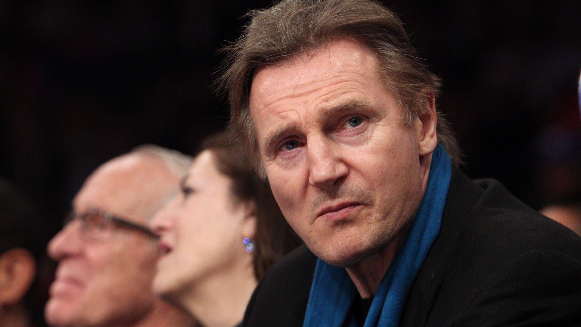 Irish actor Liam Neeson sits court side during the first quarter of a game between the New York Knicks and the Miami Heat at Madison Square Garden.