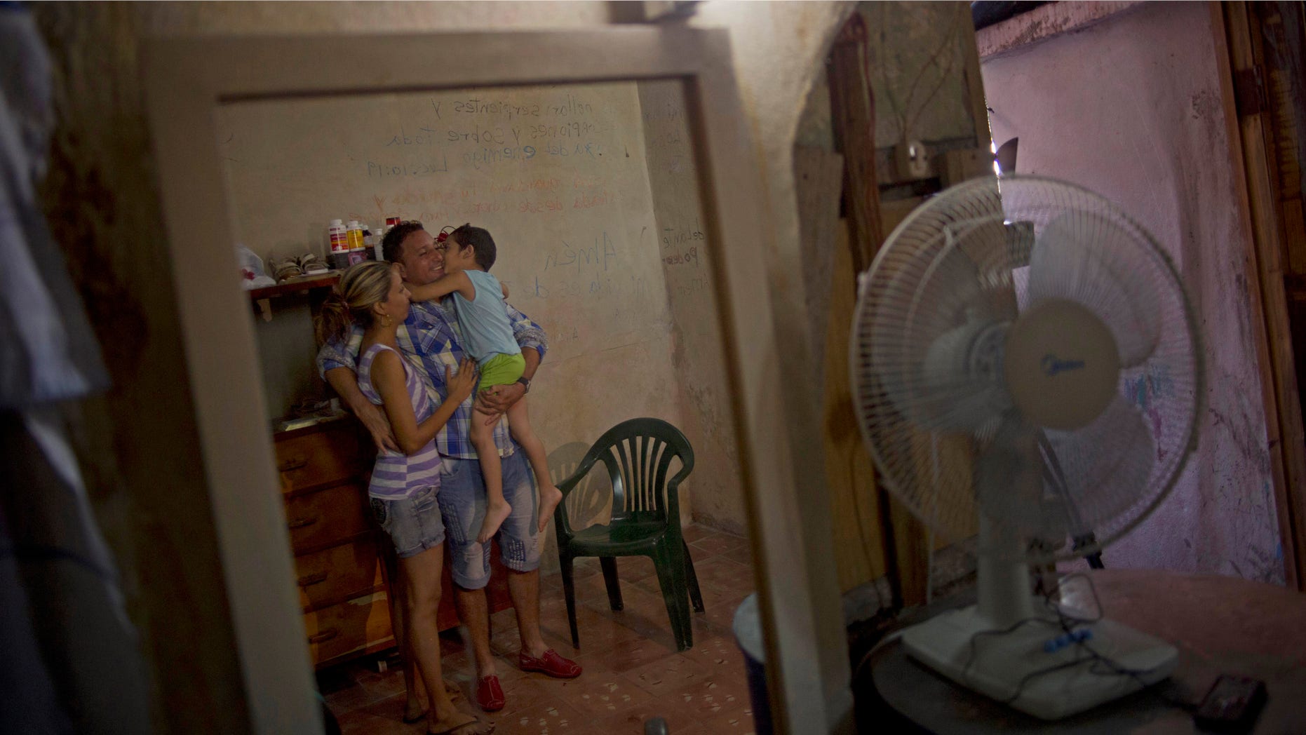 Wilberto Parada, 42, with his son and wife in Havana, Cuba after being released on Jan. 9, 2015.
