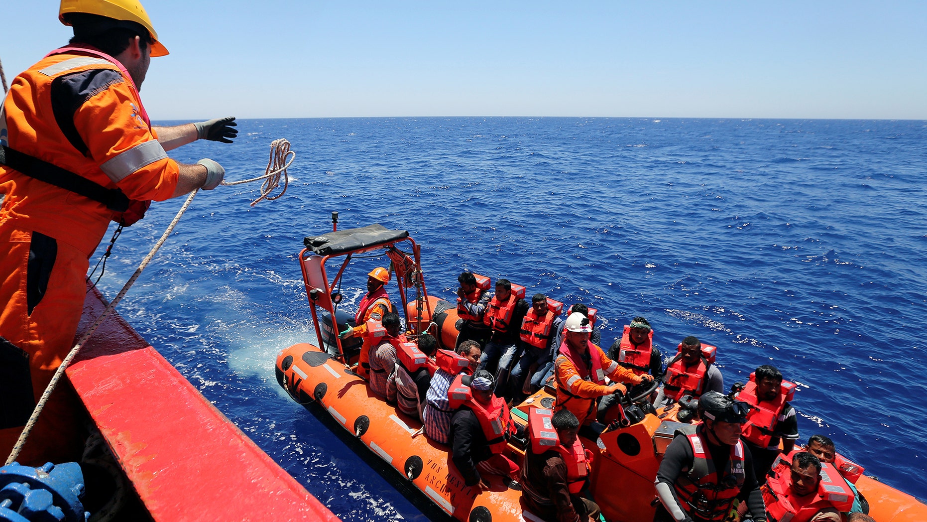 Migrants are rescued by "Save the Children" NGO crew from the ship Vos Hestia in the Mediterranean sea off Libya coast, June 15, 2017. REUTERS/Stefano Rellandini - RTS1792D