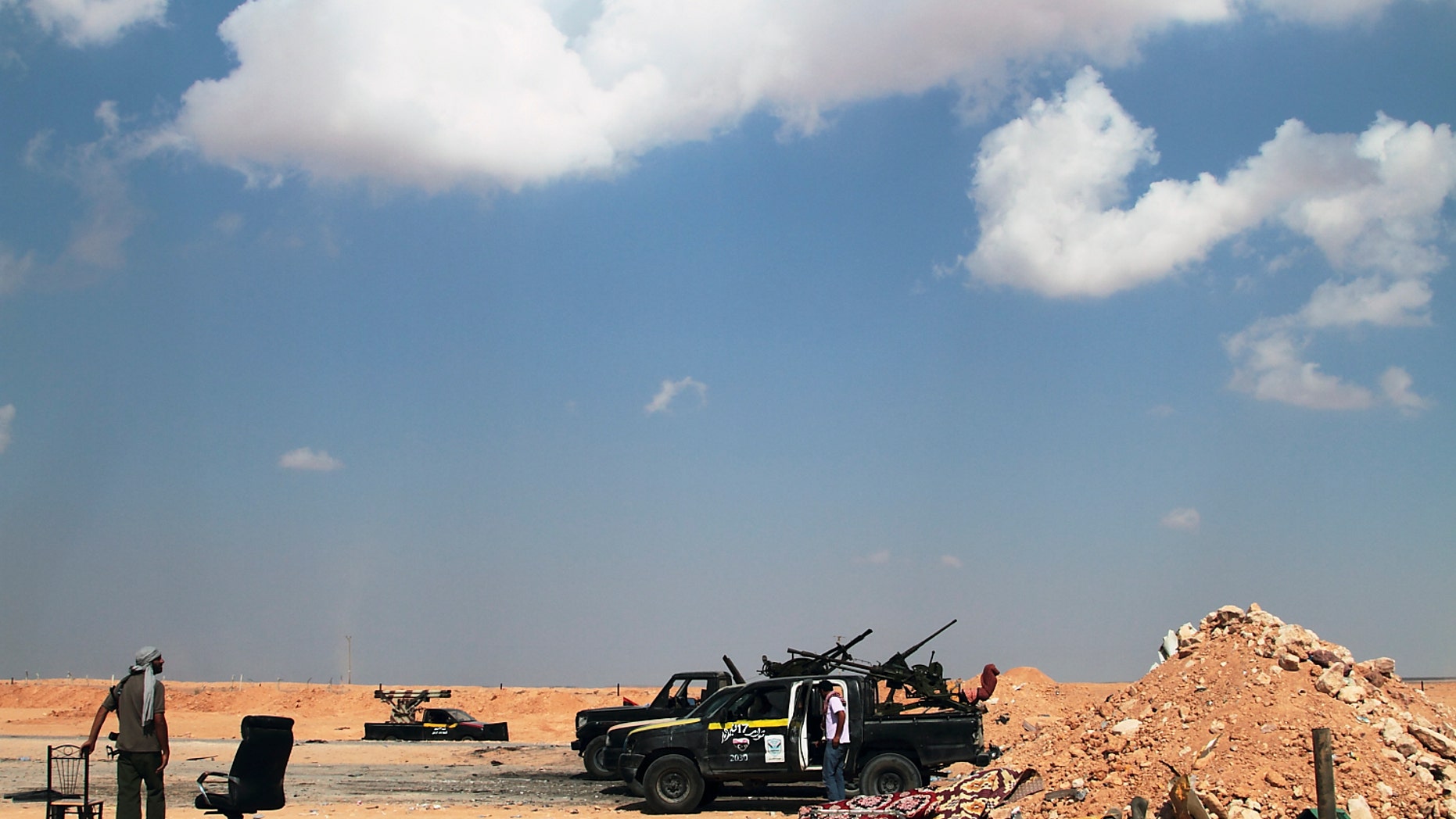 Aug. 27: Libyan rebels are seen on the road out of Misrata, 118 miles from Sirte, Libya.