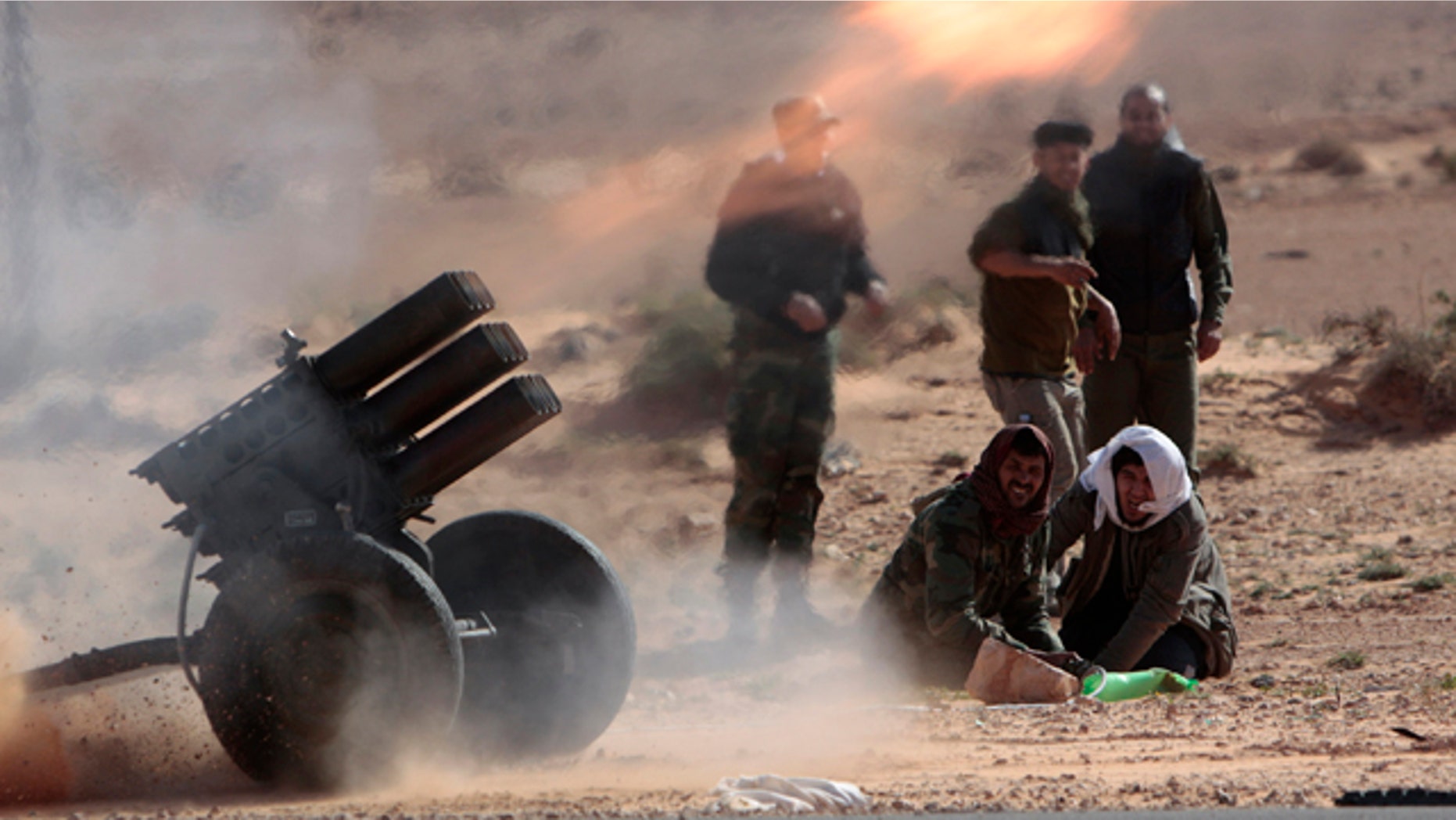 March 6, 2011: Anti-Libyan Leader Moammar Gadhafi rebels, fire multiple launcher rockets during a fighting against pro-Gadhafi fighters near the town of Bin-Jawad, eastern Libya. Thousands of Moammar Gadhafi's supporters poured into the streets of Tripoli on Sunday, waving flags and firing their guns into the air in the Libyan leader's main stronghold.