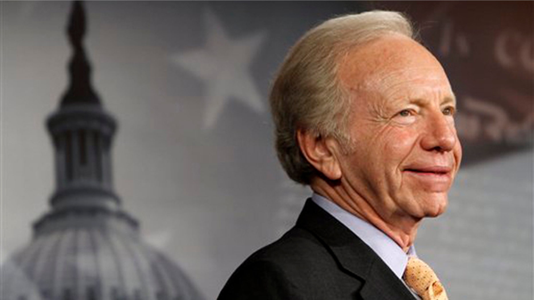 FILE: Jan. 31, 2012: Sen. Joe Lieberman smiles during a news conference on Capitol Hill.