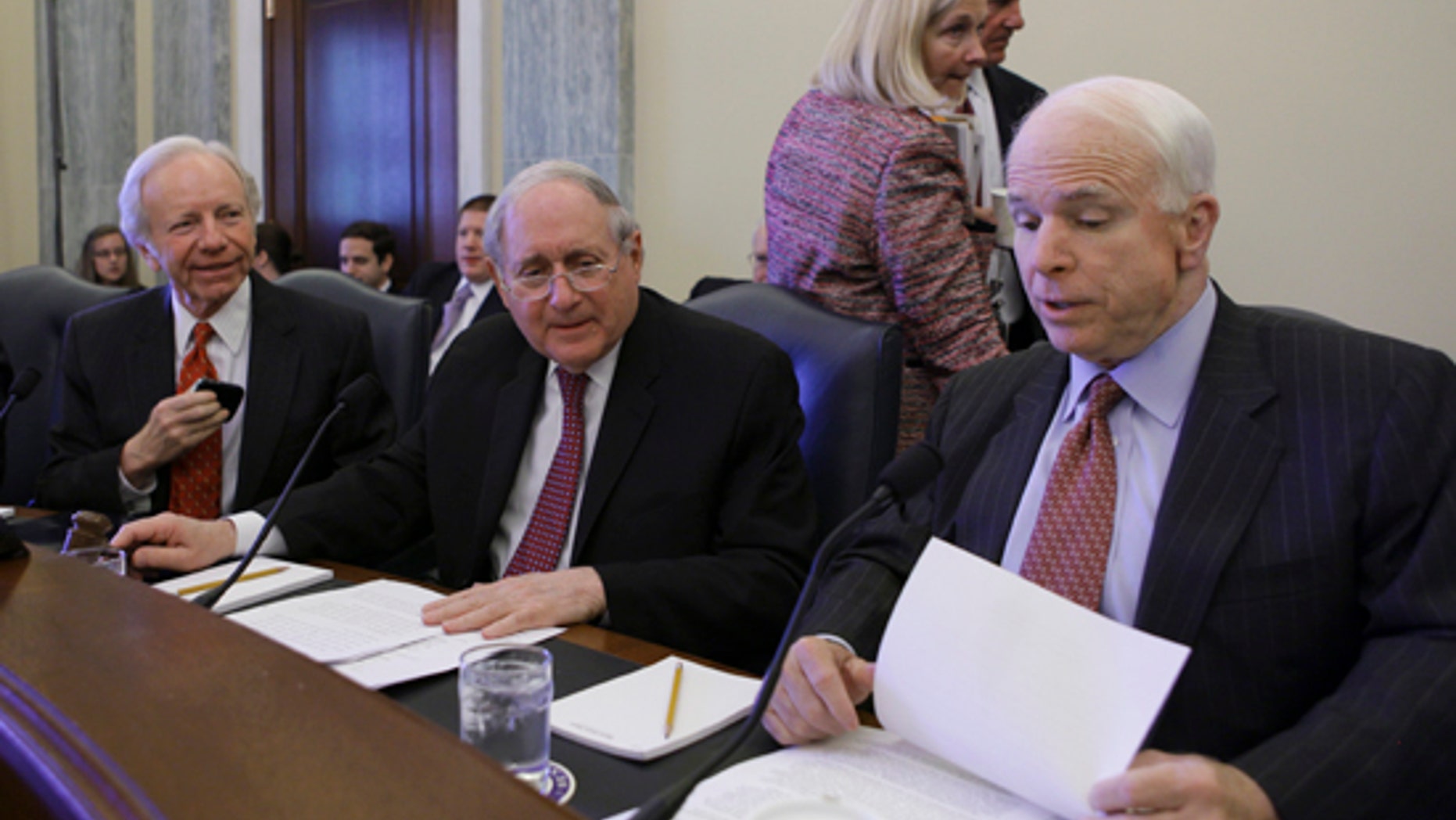 Senate Armed Services Committee Sen. Carl Levin, D-Mich., center, flanked by the committee's ranking Republican Sen. John McCain, R-Ariz., right, and Sen. Joseph Lieberman, I-Conn., prepares to open the committee's hearing on U.S. policy toward Iran's nuclear program, Wednesday, April 14, 2010. (AP)
