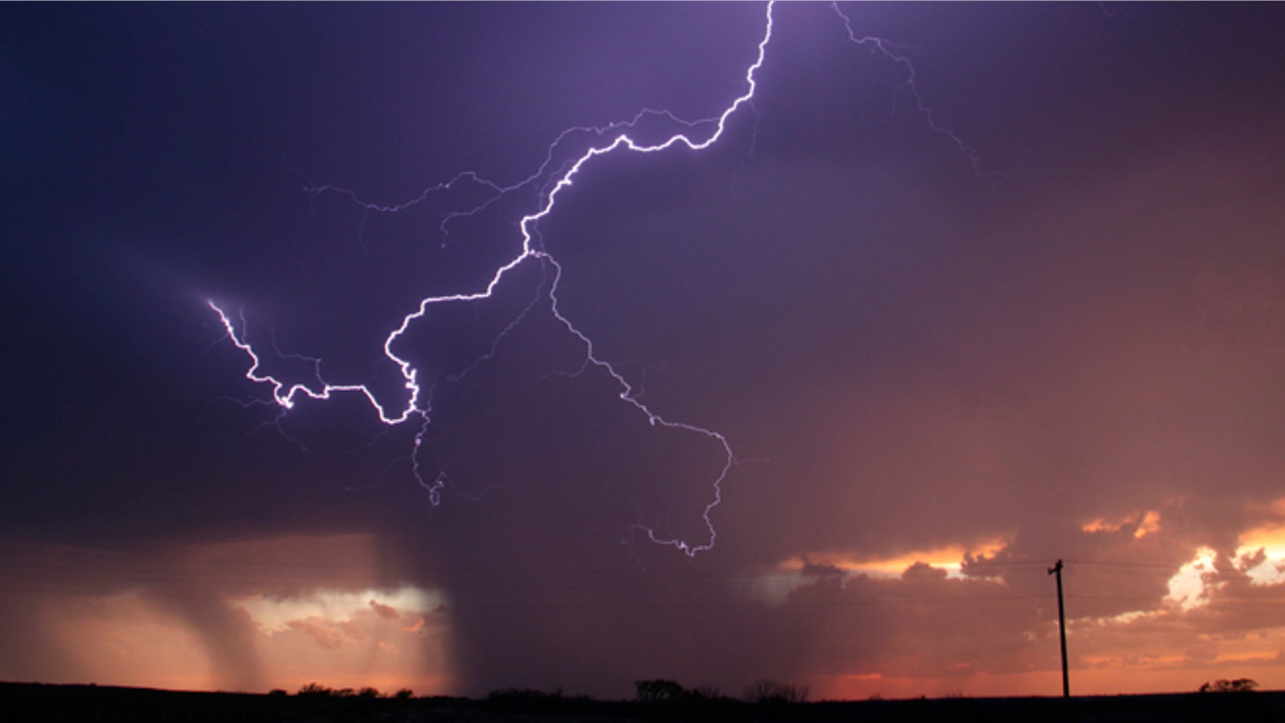 April 23, 2014: Huge lightning strikes cross the skies as thunderstorms supercells pass through areas in Archer City, Texas.