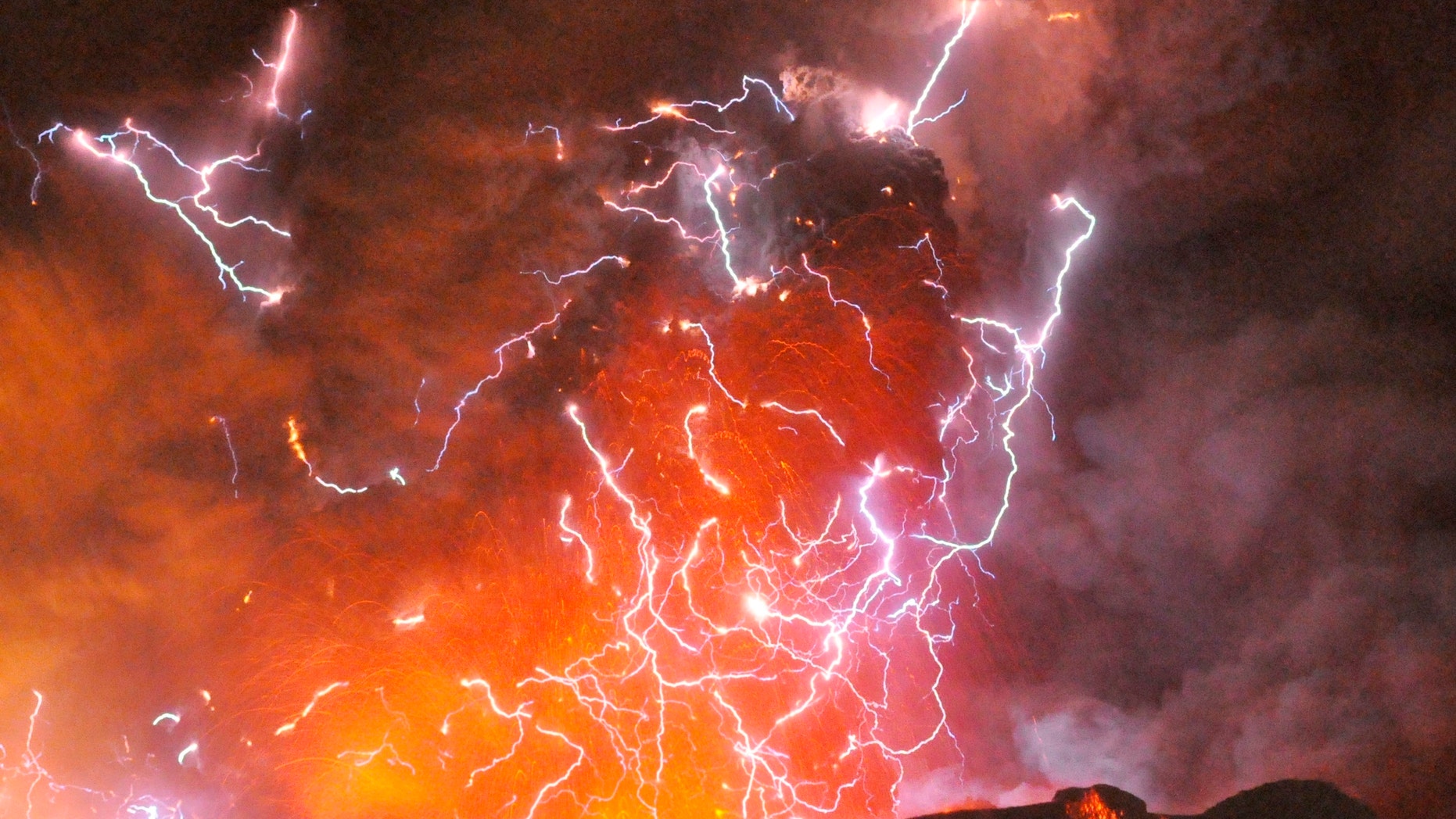 File photo - Volcanic lightning or a dirty thunderstorm is seen above Shinmoedake peak as it erupts, between Miyazaki and Kagoshima prefectures, in this photo taken from Kirishima city and released by Minami-Nippon Shimbun Jan. 28, 2011. (REUTERS/Minami-Nippon Shimbun/Handout)