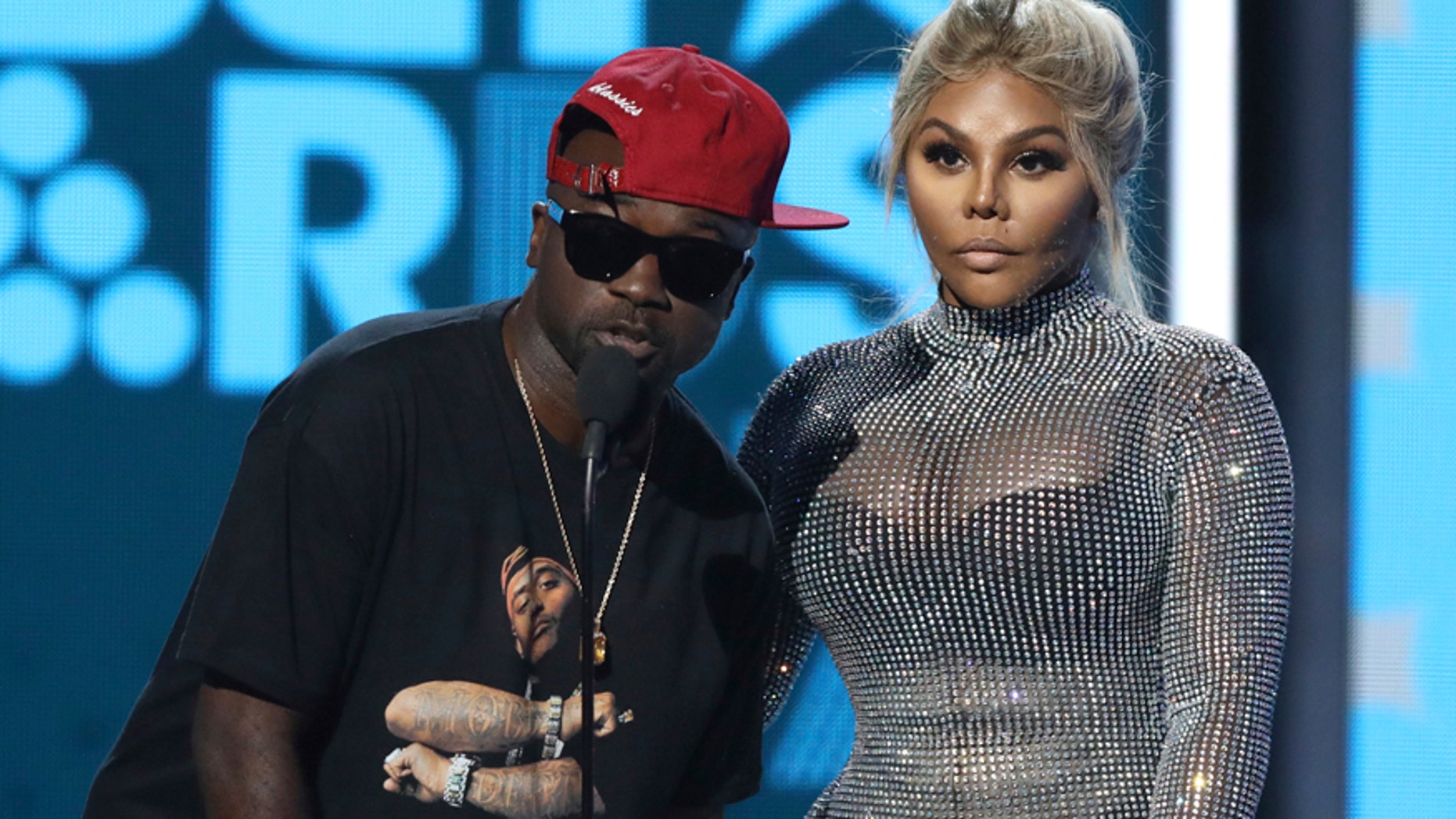 Havoc, left, and Lil Kim present the award for best male hip hop artist at the BET Awards at the Microsoft Theater on Sunday, June 25, 2017, in Los Angeles.