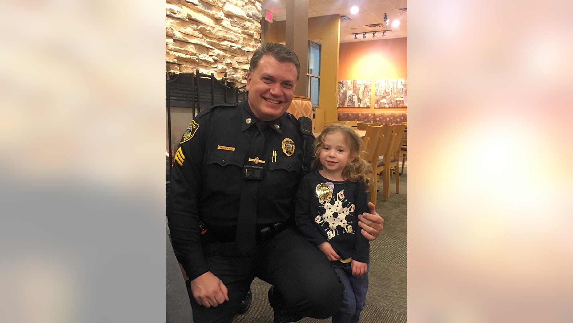 4-year-old Lillian saw Hingham Sergeant Steve Dearth eating alone and asked to join him.
