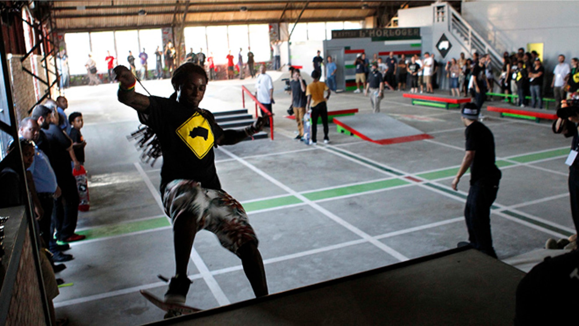 Sept. 26, 2012: Recording artist Lil Wayne skates in a new skateboard park he helped finance along with Glu Agency and Mountain Dew, in the Lower Ninth Ward of New Orleans.