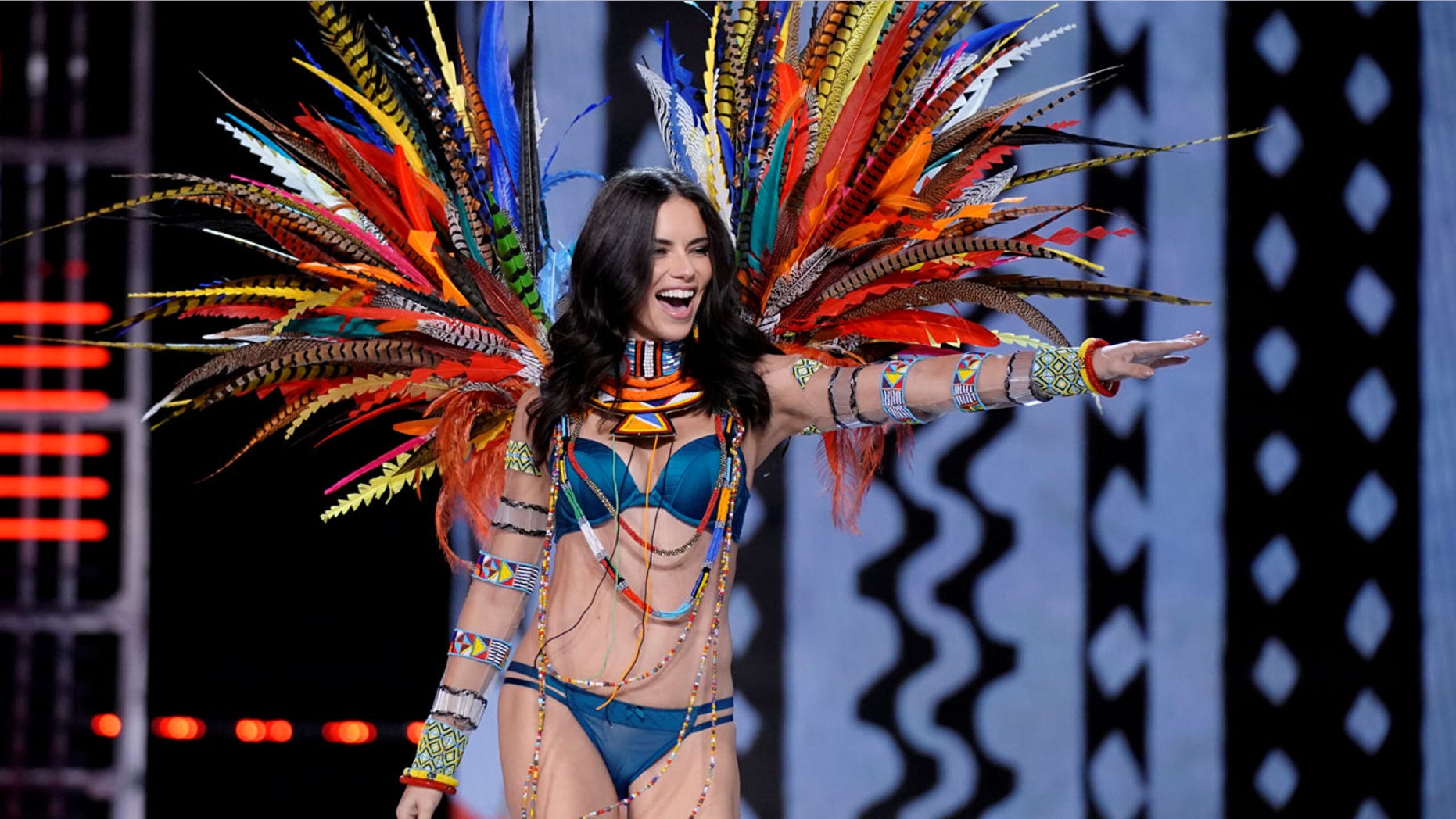 Adriana Lima has a new take on stripping down. Here the model walks the runway in Shanghai during the 2017 Victoria's Secret Fashion Show.
