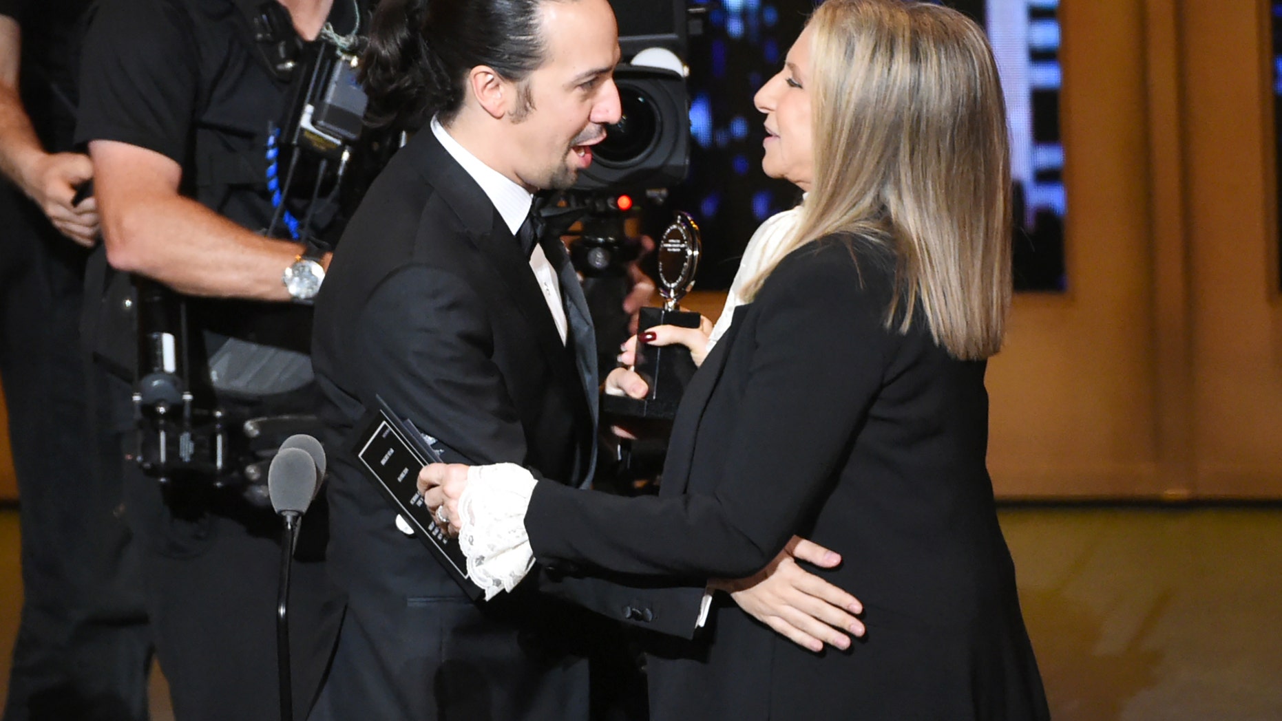 Barbra Streisand, right, presents the award for best musical to Lin-Manuel Miranda of "Hamilton" at the Tony Awards at the Beacon Theatre on Sunday, June 12, 2016, in New York. (Photo by Evan Agostini/Invision/AP)