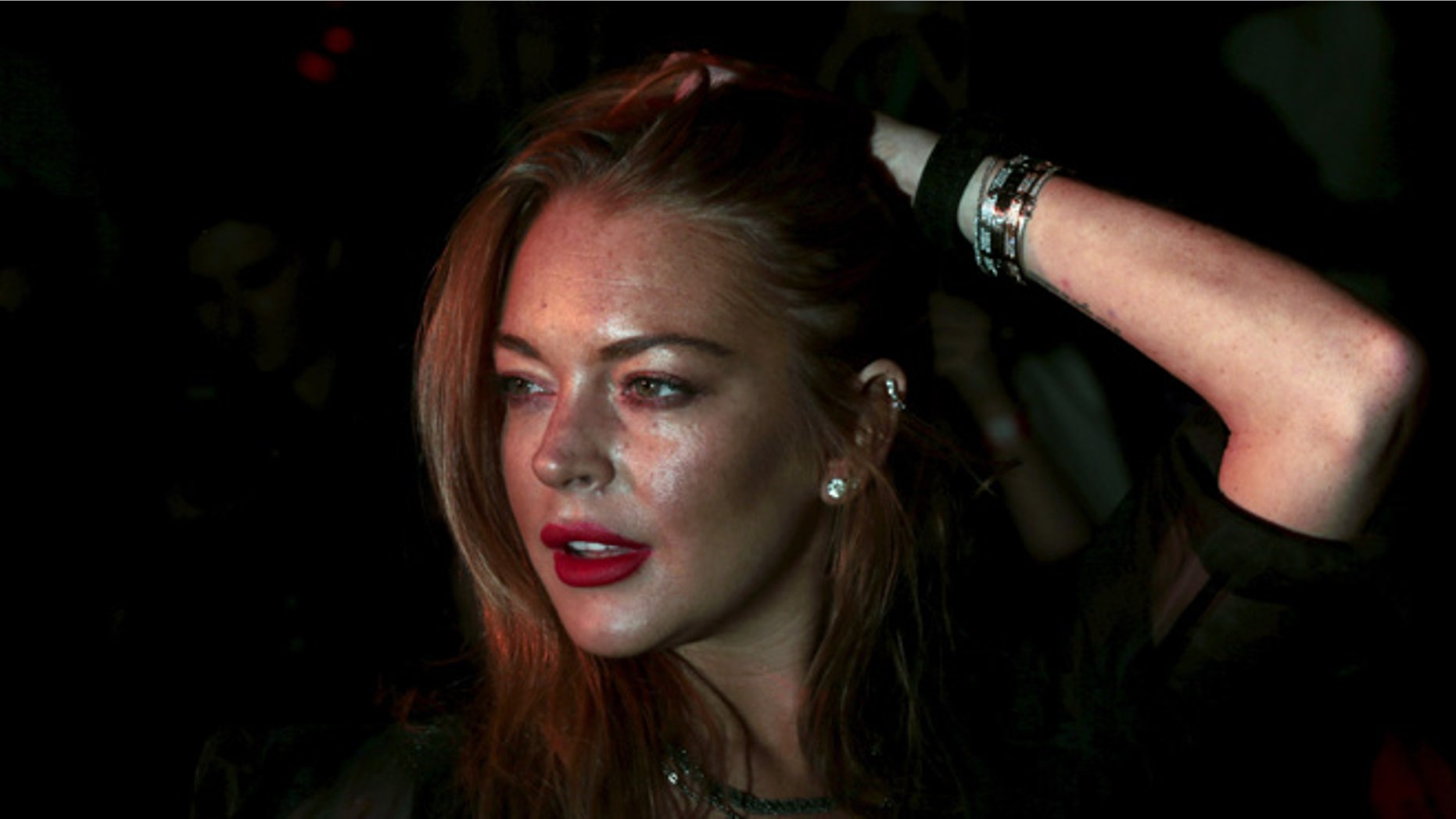 Lindsay Lohan teased her return to films with a movie poster for her upcoming film "The Shadow Within."