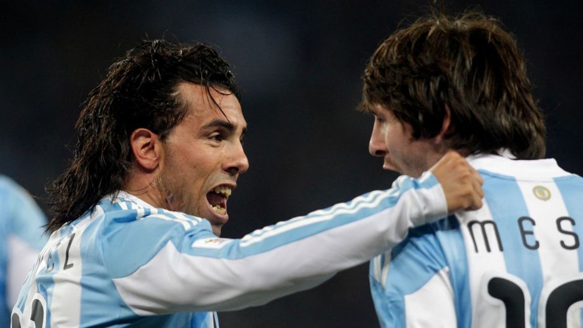 Football - Argentina v Mexico FIFA World Cup Second Round - South Africa 2010 - Soccer City Stadium, Johannesburg, South Africa - 27/6/10 Carlos Tevez celebrates with Lionel Messi (R) after scoring Argentina's first goal Mandatory Credit: Action Images / Andrew Boyers Livepic
