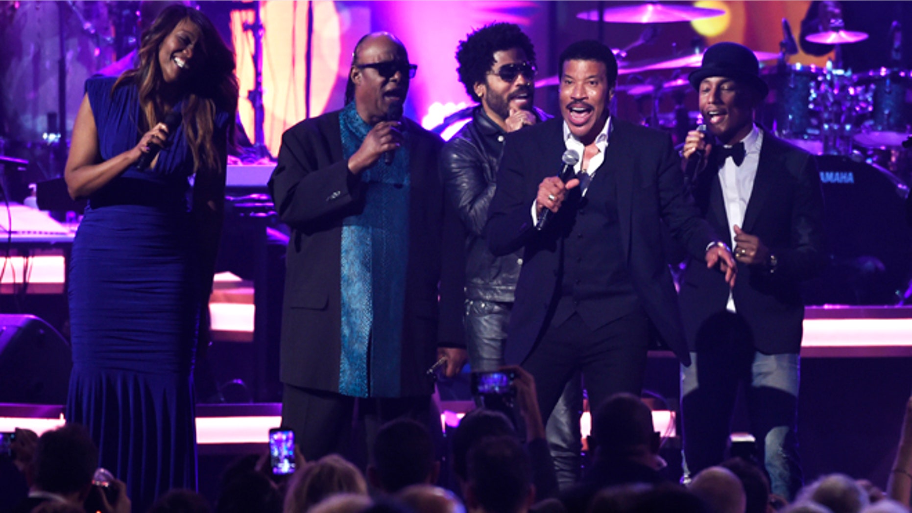 Feb 13, 2016. Honoree Lionel Richie performs at the MusiCares Person of the Year tribute at the Los Angeles Convention Center. Pictured from left are Yolanda Adams, Stevie Wonder, Lenny Kravitz and Pharrell Williams.