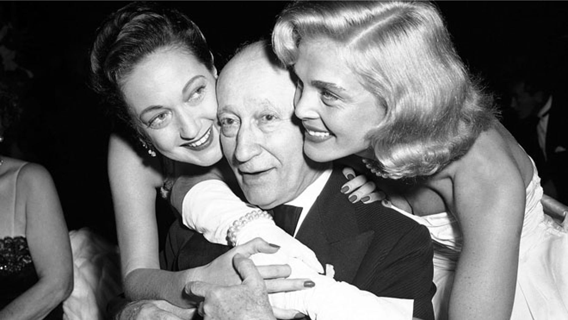 Jan. 7, 1953: Adolph Zukor, gets birthday hugs from Dorothy Lamour, left, and Lizabeth Scott at film industry dinner in the Hollywood section of Los Angeles.