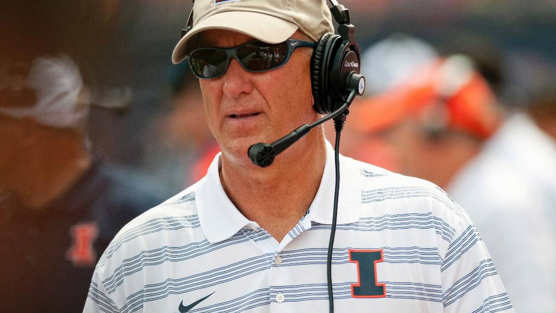 In this Aug. 30, 2014 file photo, Illinois offensive coordinator Bill Cubit watches from the sidelines during a game against the Youngstown State in Champaign, Ill. With starting quarterback Wes Lunt out until mid-November with an injury, Illini head coach Tim Beckman plans to use a pair of quarterbacks when they host Minnestoa Saturday, Oct. 25. Cubit told reporters he's trying to figure out how he’ll use both quarterbacks. (AP Photo/Bradley Leeb, File)