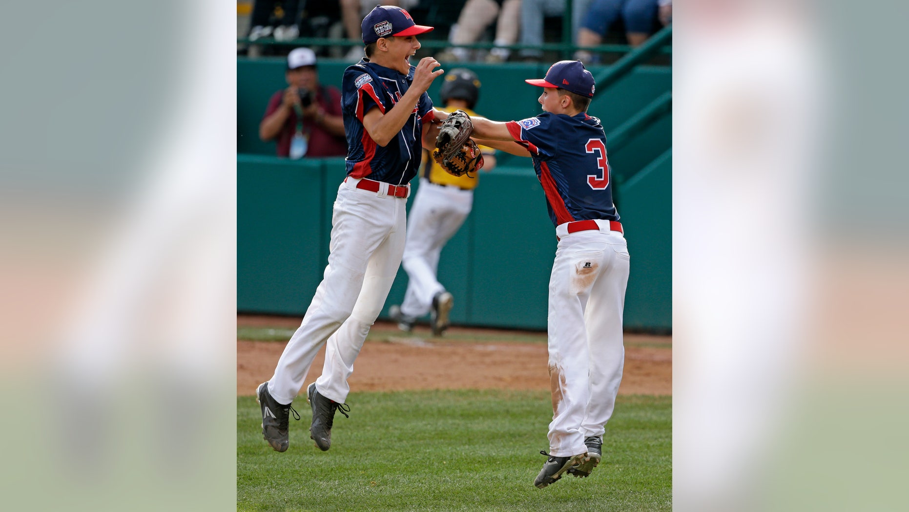 Michael Mancini, left, celebrates with Jude Abbadessa during the U.S. championship game of the Little League World Series.