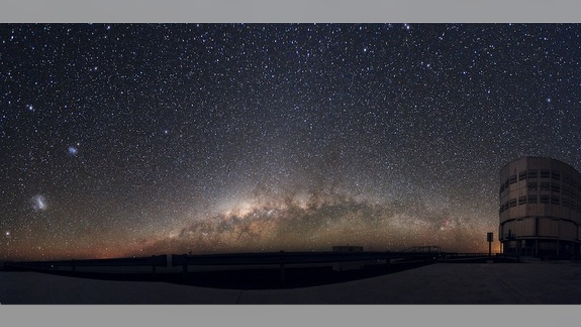 As the Milky Way rises over the horizon at the European Southern Observatory, its companion galaxies also come into view. The Large Magellanic Cloud (LMC) at far left lies about 160,000 light-years away, while the Small Magellanic Cloud (SMC, a