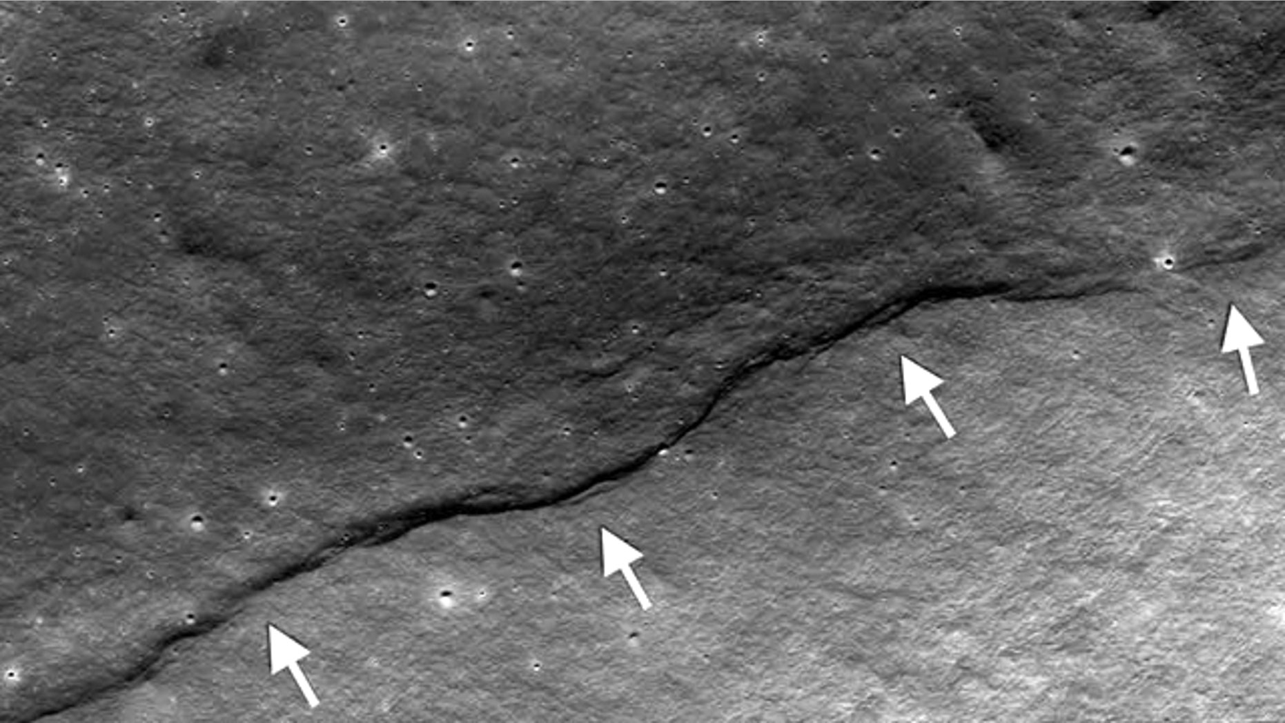 By analyzing new photos of faults such as this on the moon, scientists have concluded that our nearest heavenly body is shrinking.