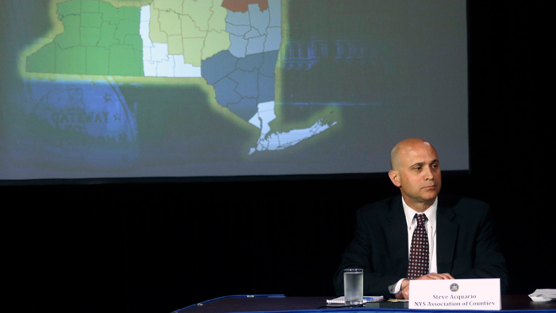 In this May 9, 2013 file photo, Stephen Acquario, executive director of the New York State Association of Counties, attends a news conference in the Red Room at the Capitol in Albany, N.Y. Acquario is among hundreds of lobbyists in at least 20 states who get public pensions because they represent associations of counties, cities and school boards, an Associated Press review found.