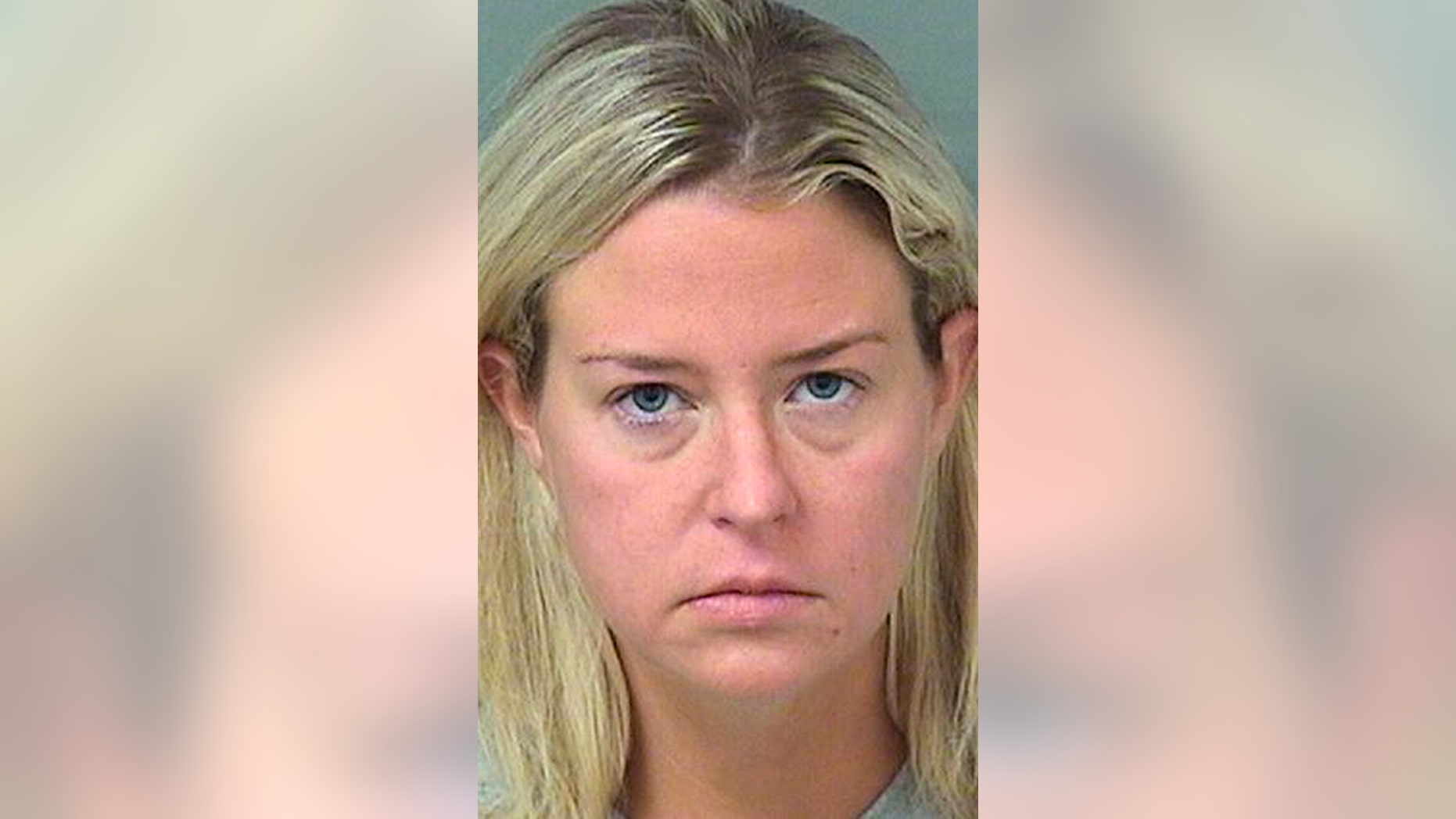 This photo provided provided by the Palm Beach County Sheriff's Office shows Kate Major Lohan shortly after her arrest on a battery charge in Boca Raton, Fla., on Friday, July 27, 2018. Kate Lohan, 35, is the stepmother of actress Lindsay Lohan. (Palm Beach County Sheriff's Office via AP)