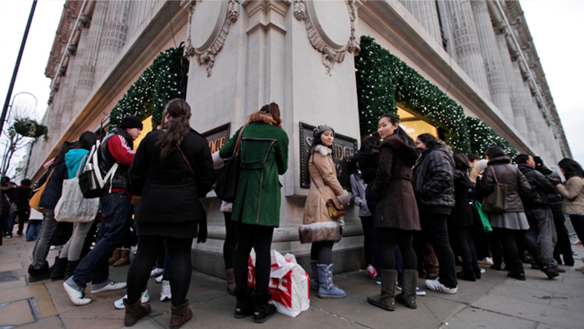 Dec. 26, 2011: People queue early in the morning outside a department store ahead of it opening for Boxing Day sales in central London.