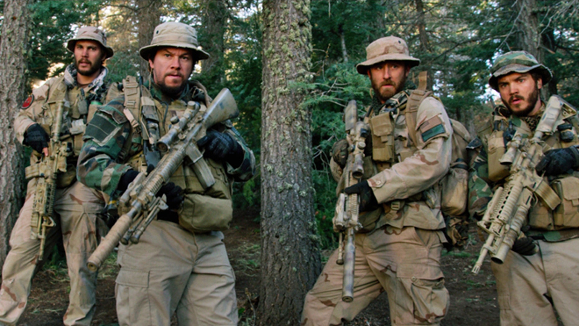 FILE: From left, Taylor Kitsch, as Michael Murphy, Mark Wahlberg as Marcus Luttrell, Ben Foster as Matt Axe Axelson, and Emile Hirsch as Danny Dietz in a scene from the film "Lone Survivor."