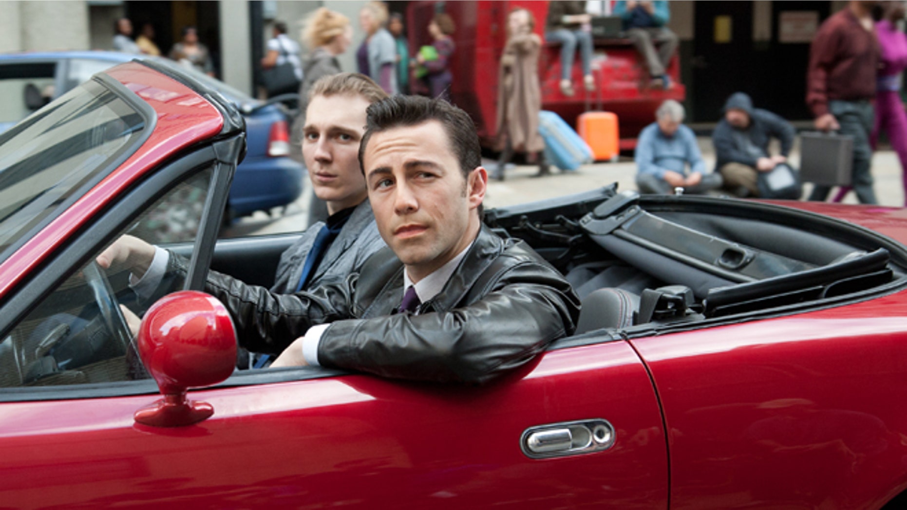 Joseph Gordon-Levitt, foreground, and Paul Dano in a scene from the action thriller "Looper"