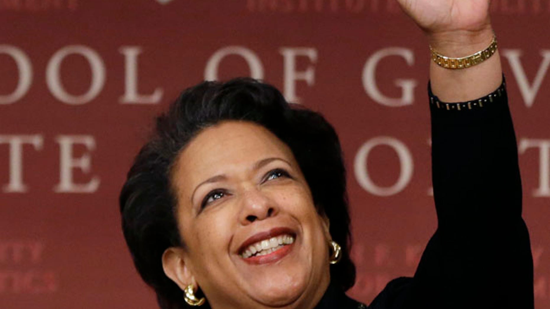 Former U.S. Attorney General Loretta Lynch, the nation's first black woman to head the Justice Department, waves as she arrives to speak at a conference on policy and blacks at Harvard University's Kennedy School of Government, Friday, April 7, 2017, in Cambridge, Mass. The 57-year-old North Carolina native graduated from Harvard College in 1981 and from Harvard Law School in 1984. (AP Photo/Elise Amendola)